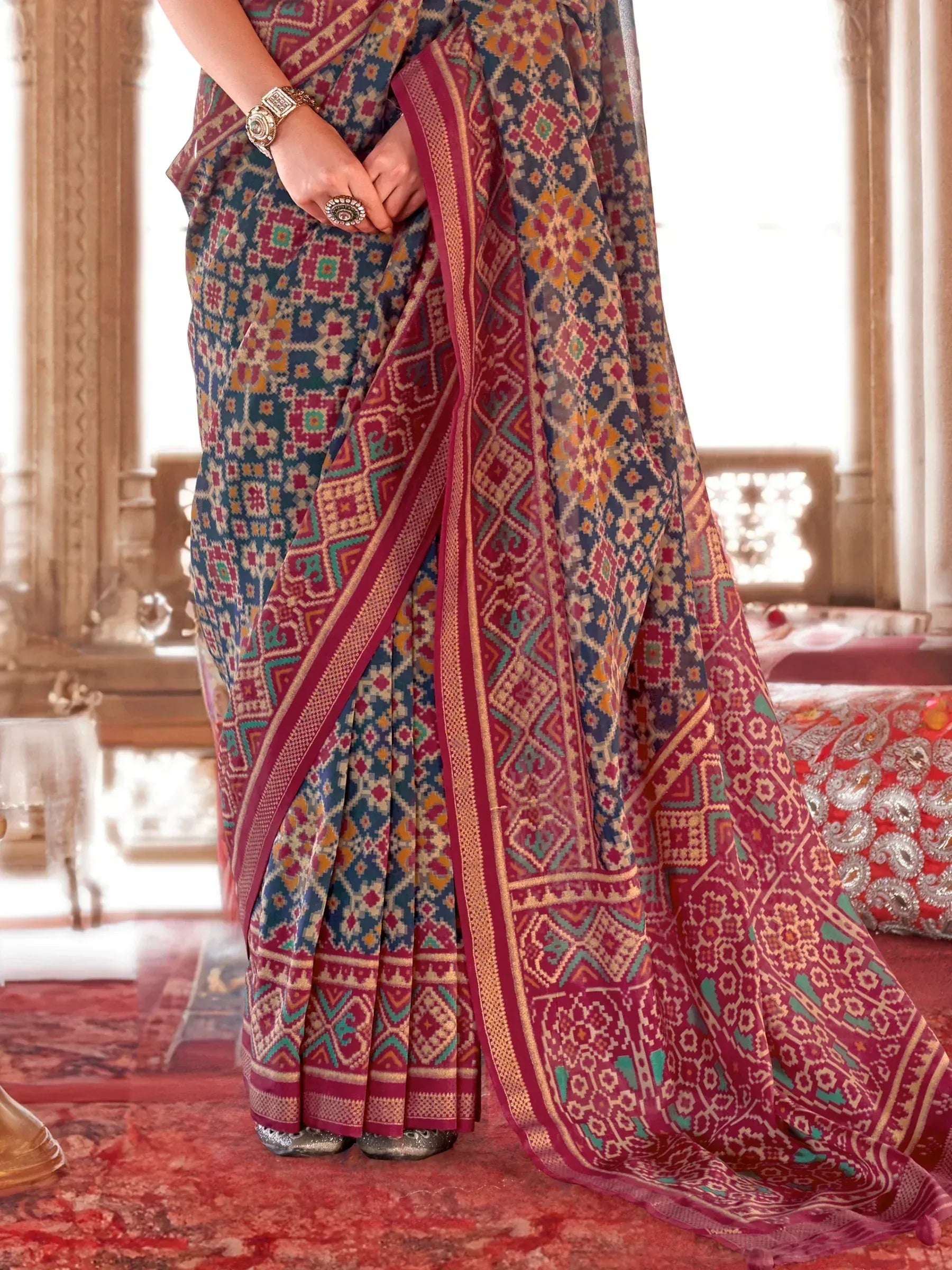 Woman in vibrant Indian saree with geometric print, ethnic wear for festive occasions
