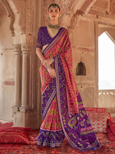 Bewitching Coral Red Patola Printed Georgette Saree With Purple Blouse