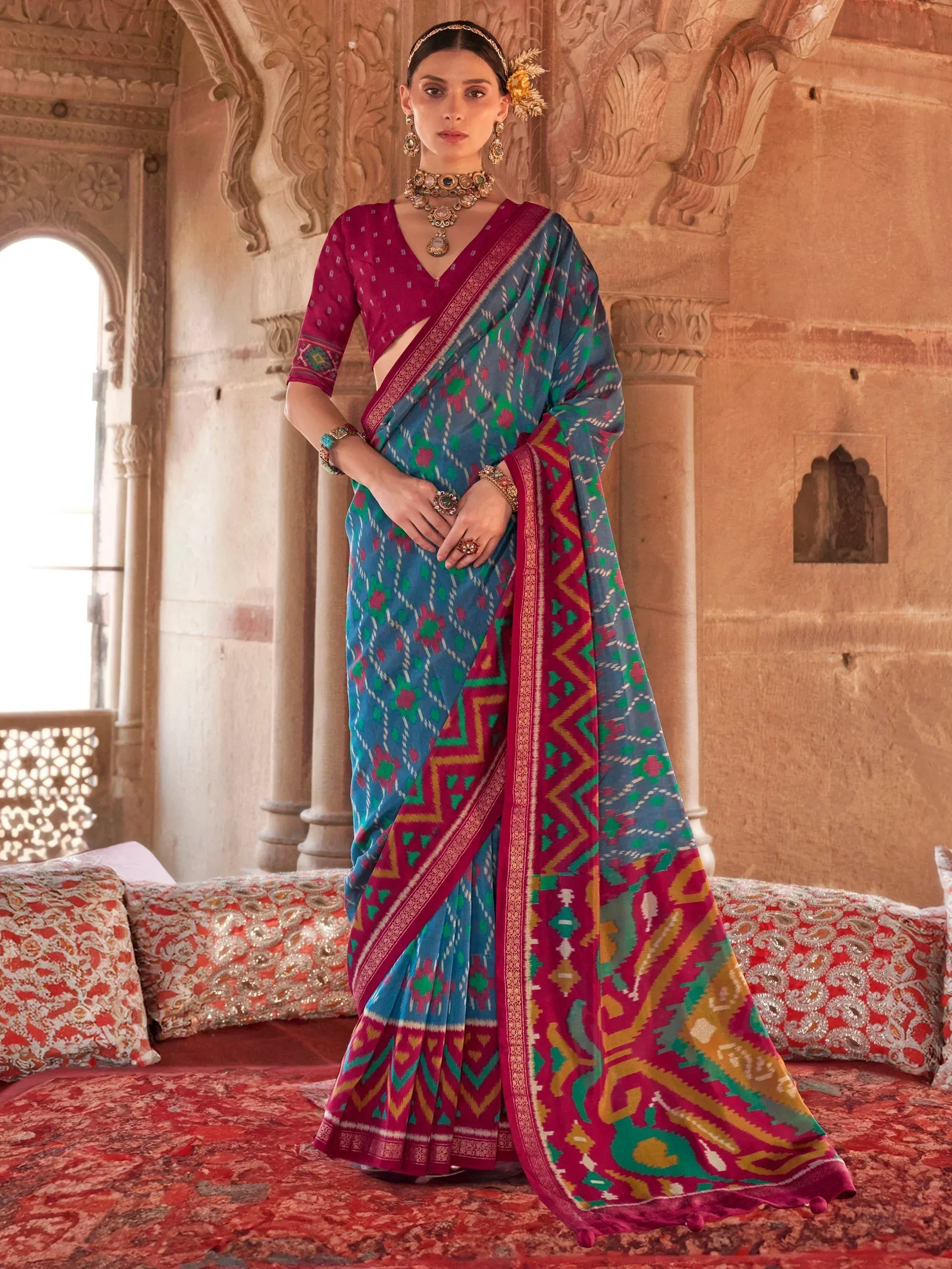 Blue and pink ikat saree with geometric print, paired with matching blouse, traditional Indian ethnic wear
