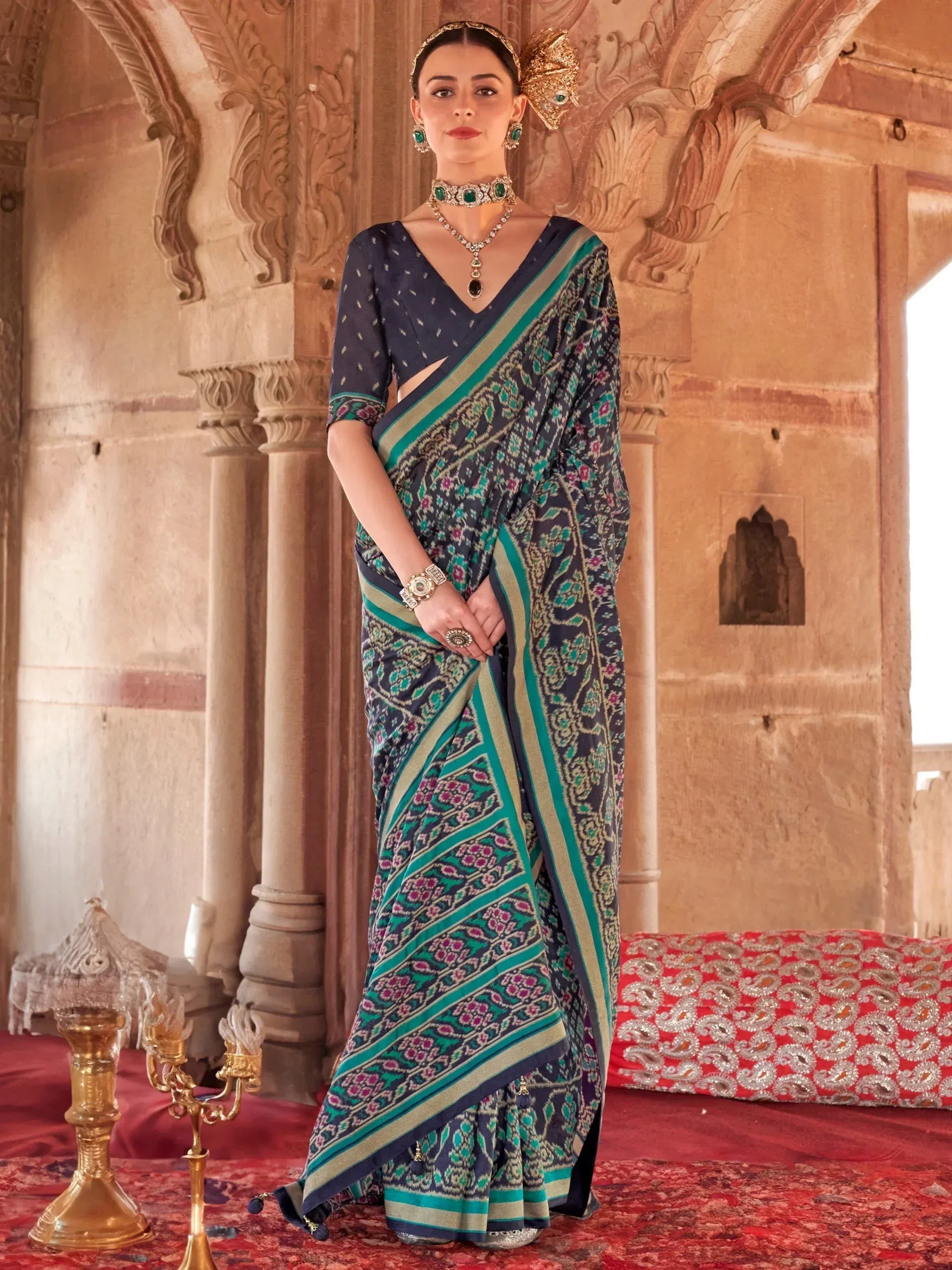 Elegant navy blue and teal printed saree with traditional jewelry, perfect for Indian ethnic occasions