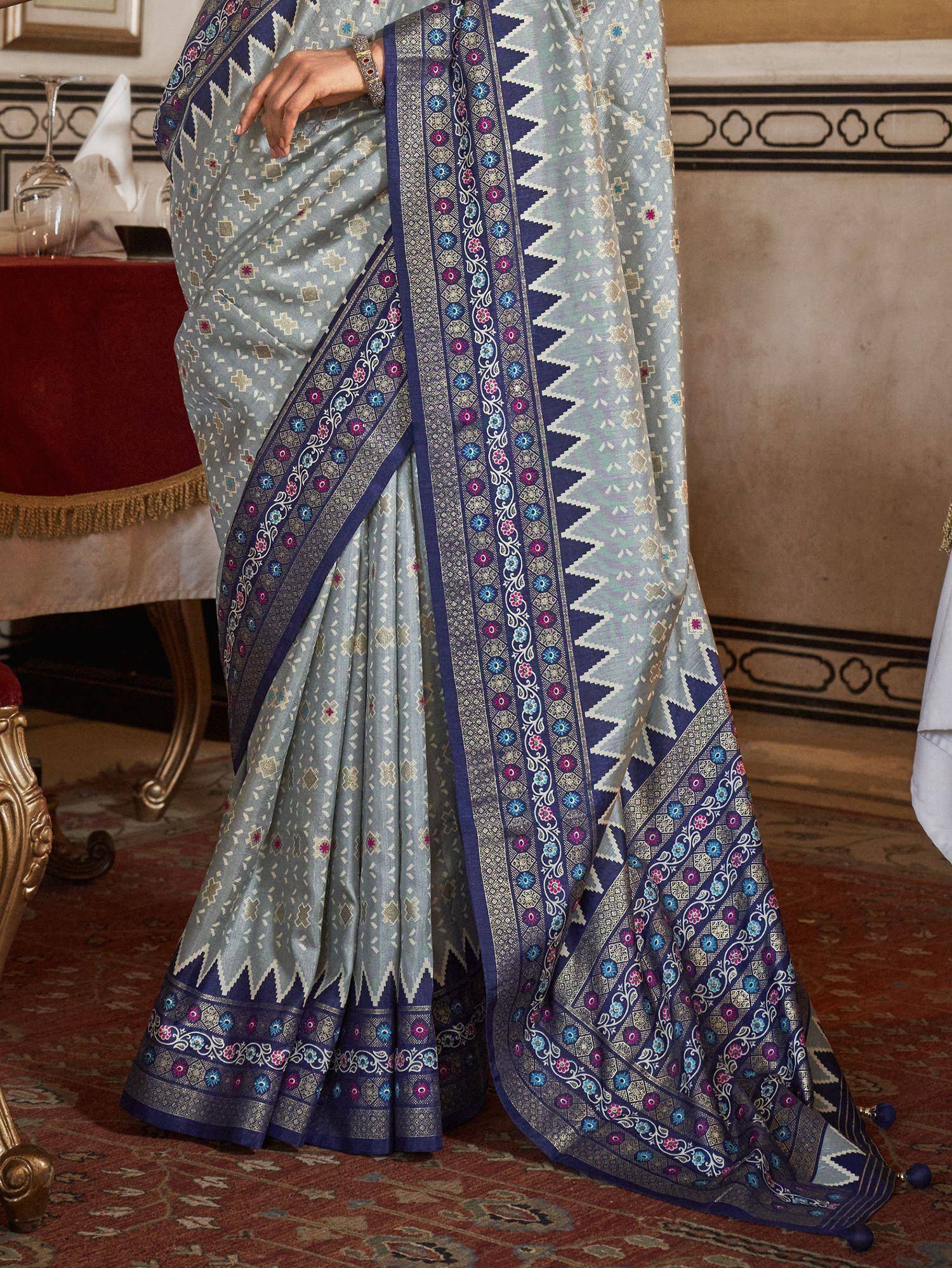 Elegant light blue saree with navy blue floral border, perfect for Indian ethnic occasions