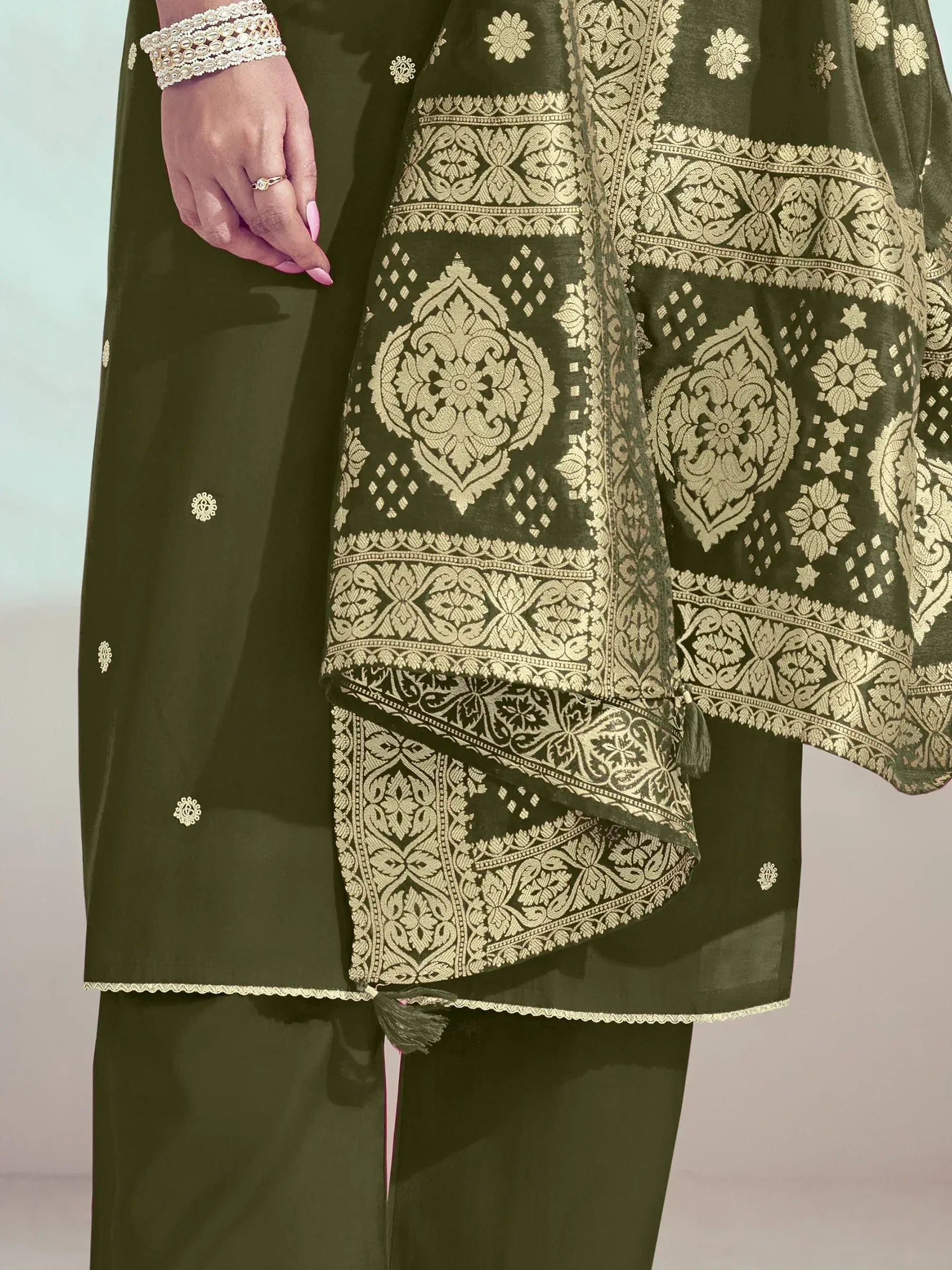 Olive green ethnic salwar kameez with gold brocade dupatta, floral embroidery, and tassels for women