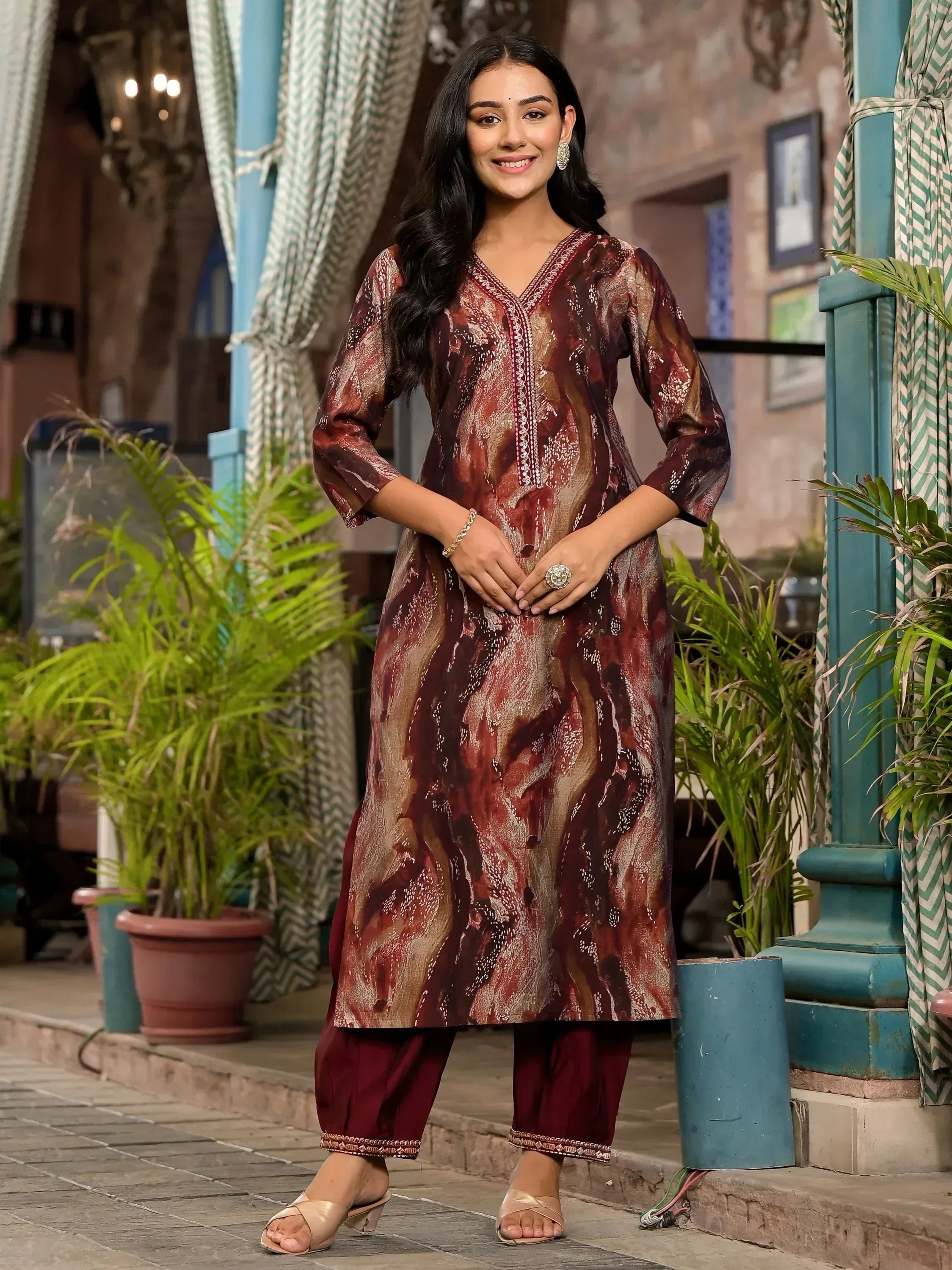 Woman in maroon printed kurta with palazzo pants, ethnic Indian wear for festive occasions