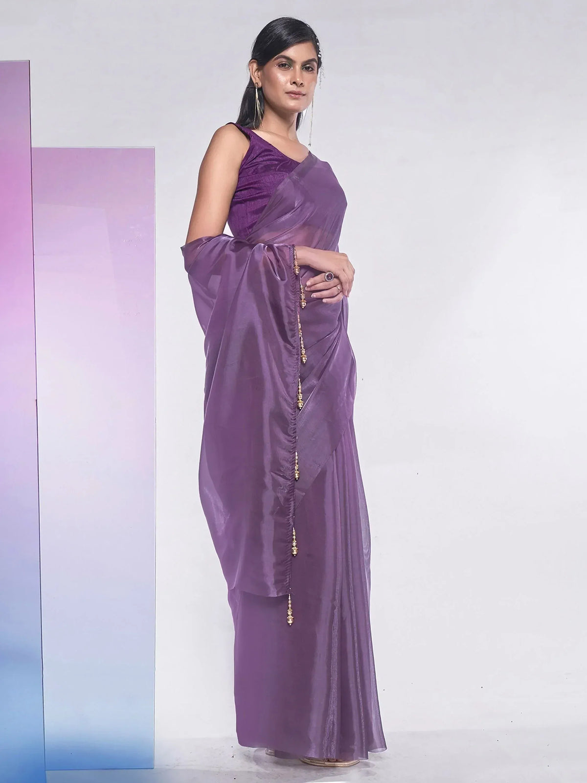 Purple designer saree with gold tassels, ethnic wear for women, stylish Indian saree