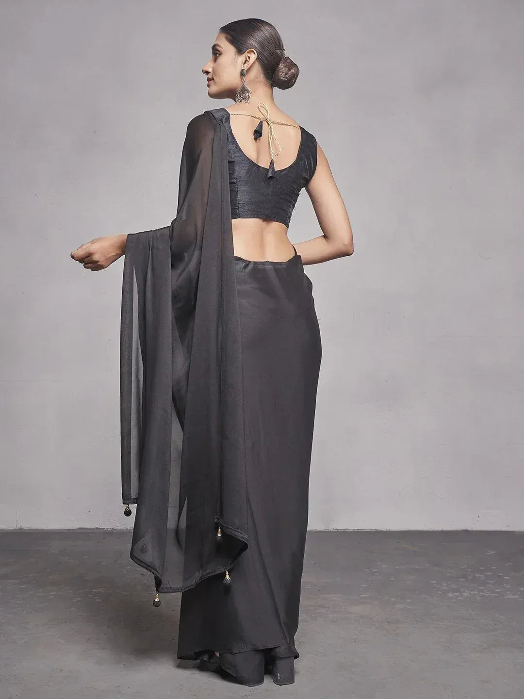 Black ethnic saree with backless blouse and sheer dupatta, perfect for Indian occasions