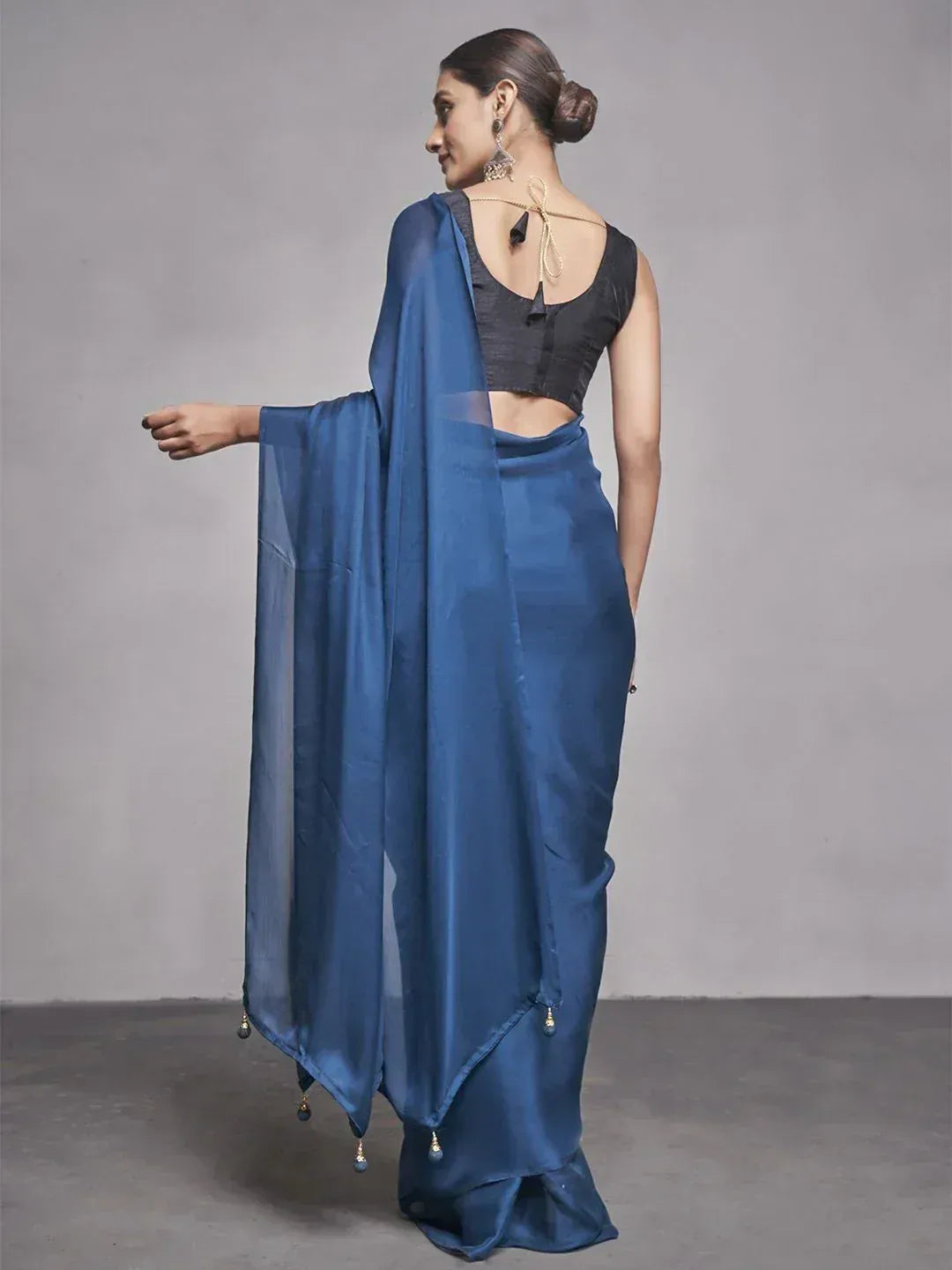 Blue saree with black blouse, tassel detailing, elegant ethnic wear for women