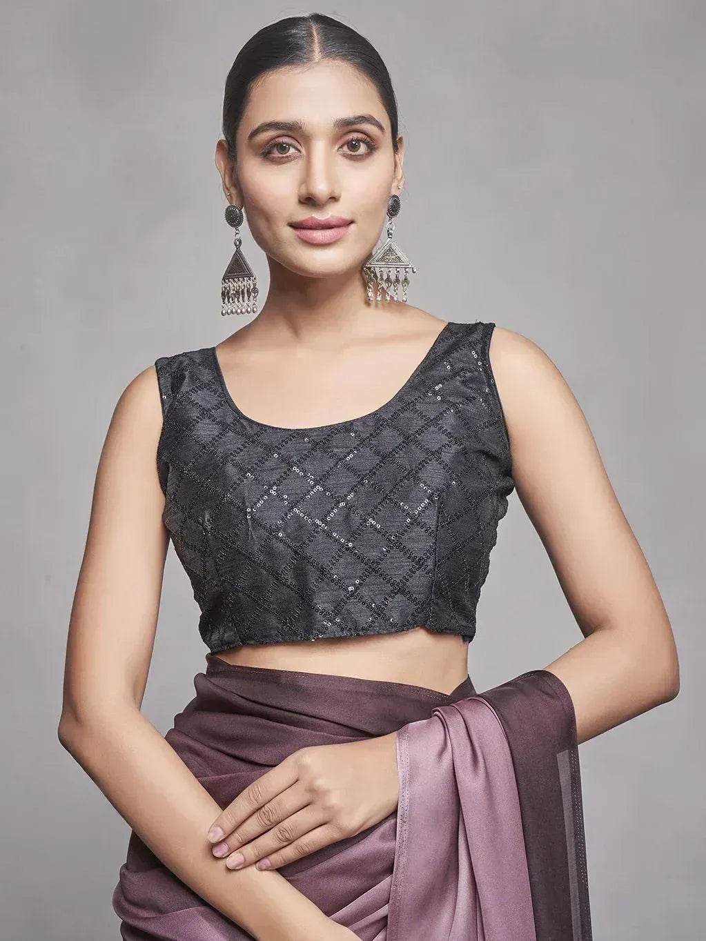 Black sequin sleeveless blouse with purple saree, ethnic Indian wear for women