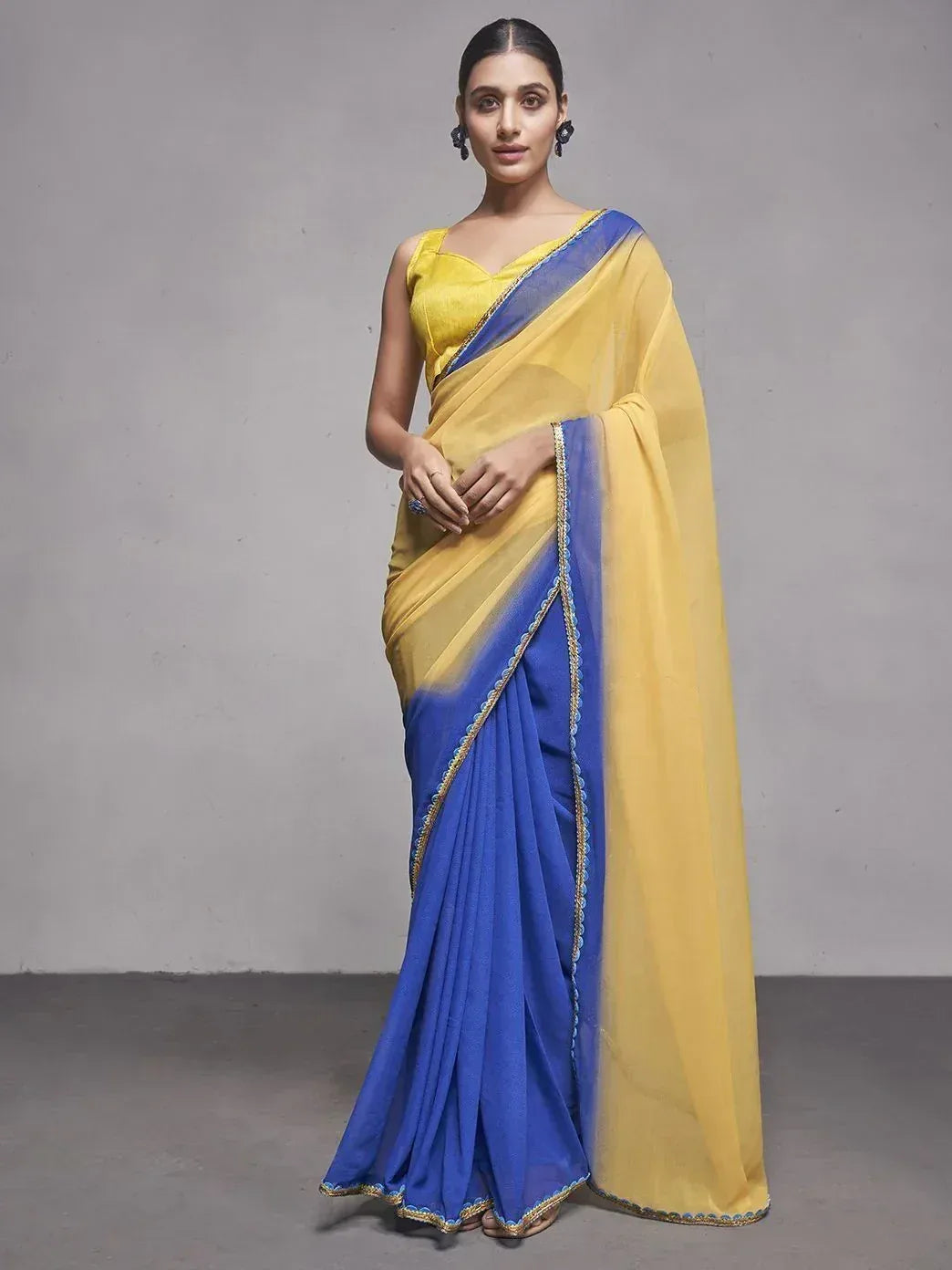 Yellow and blue designer saree with gold border, perfect for ethnic occasions