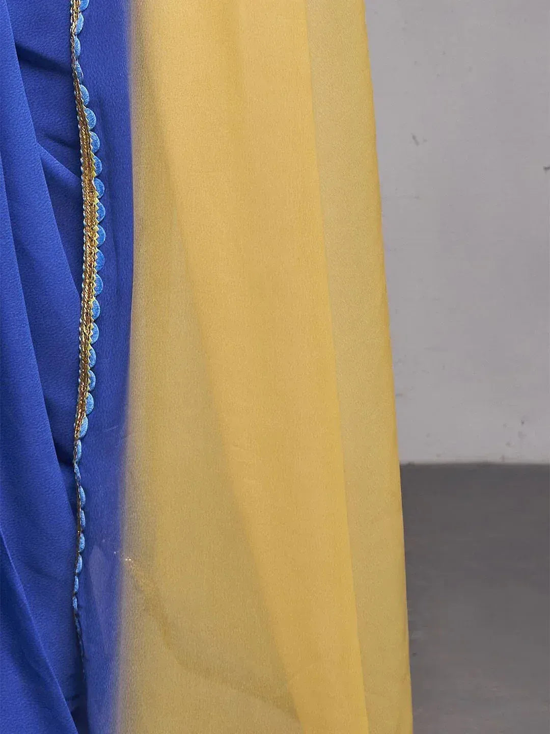 Blue and yellow ethnic saree with gold scalloped border detailing