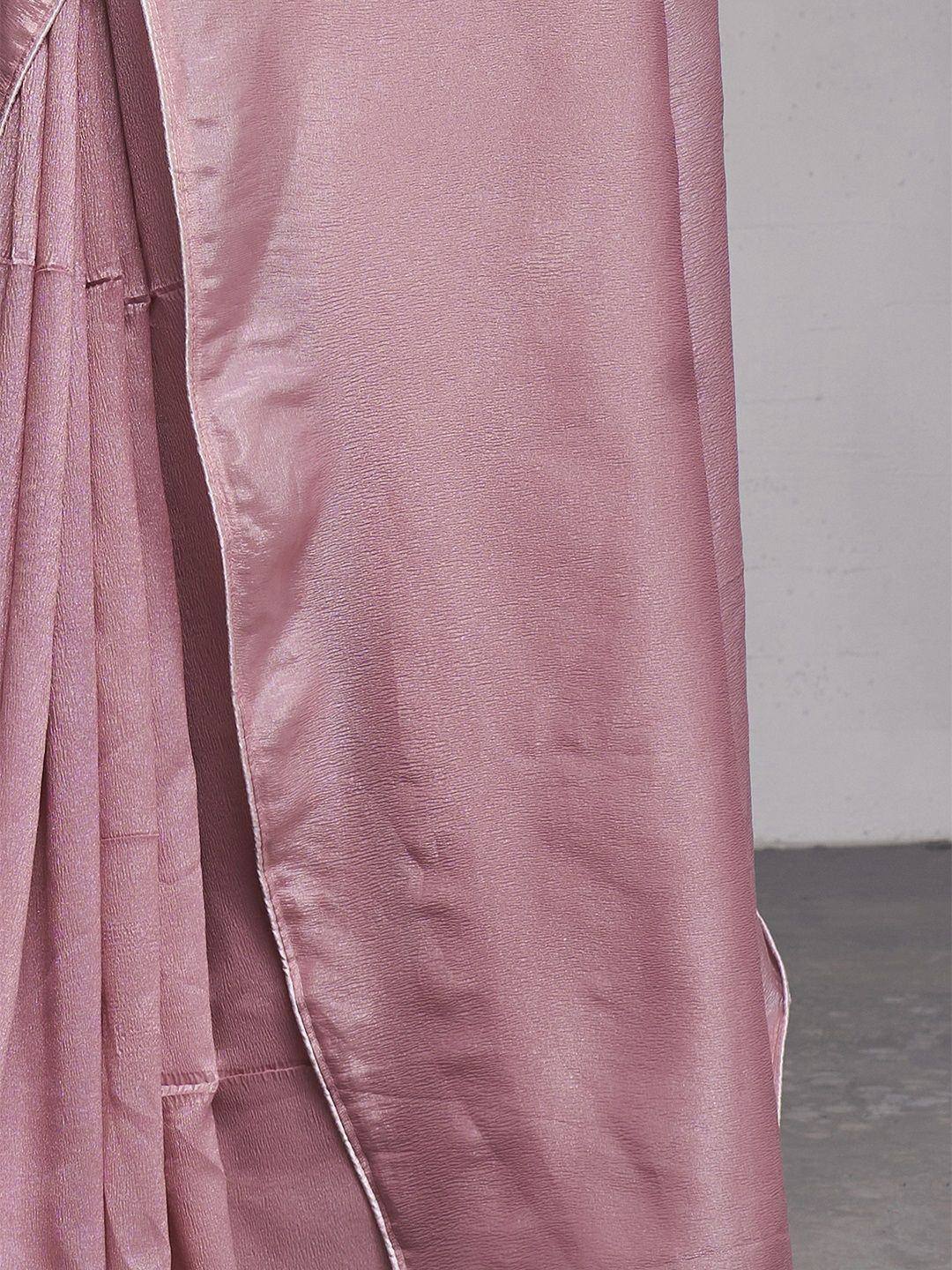 Pink silk saree with pleats and elegant drape