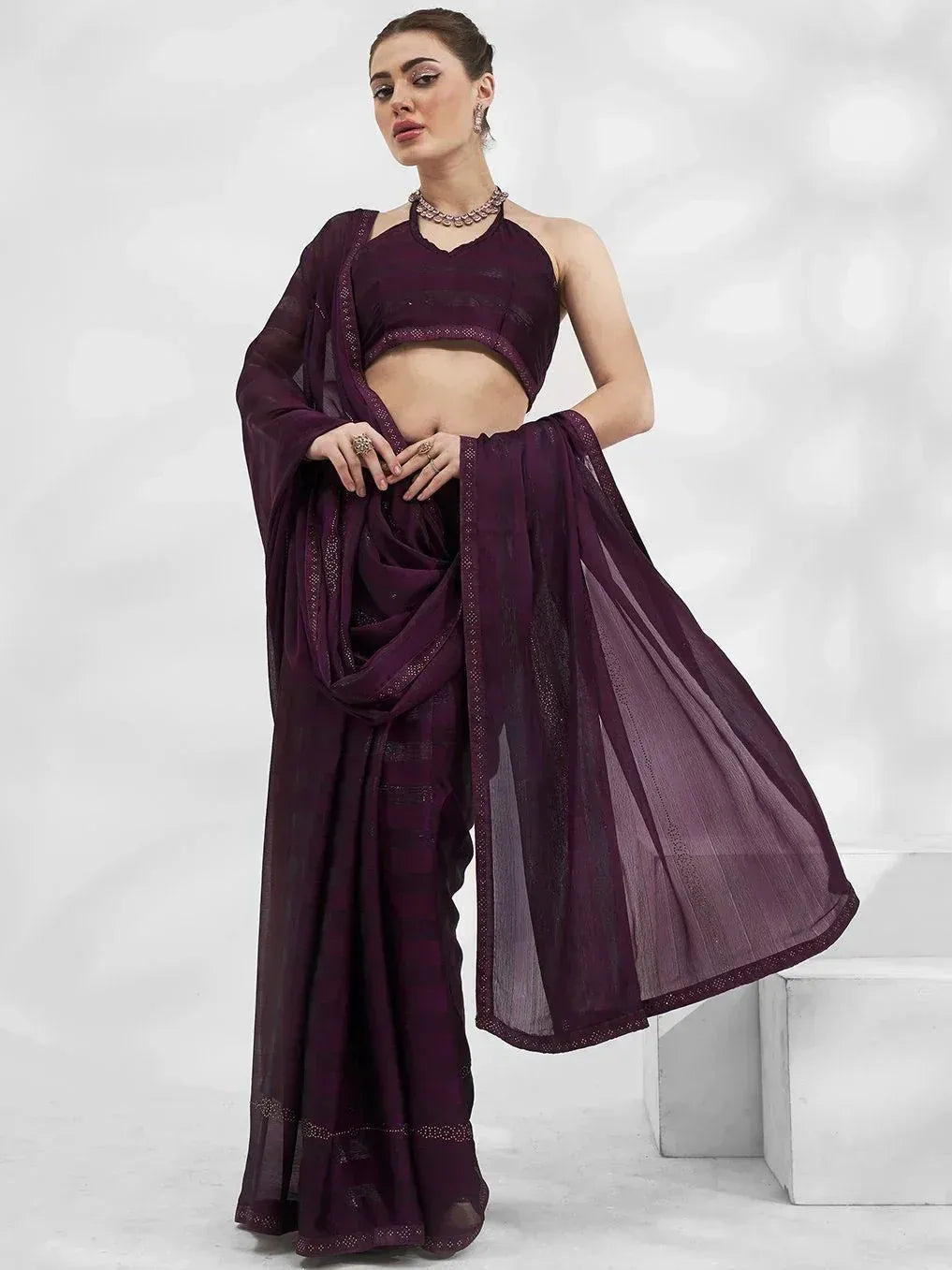 Elegant purple ethnic saree with halter neck blouse, perfect for Indian occasions and festive wear.