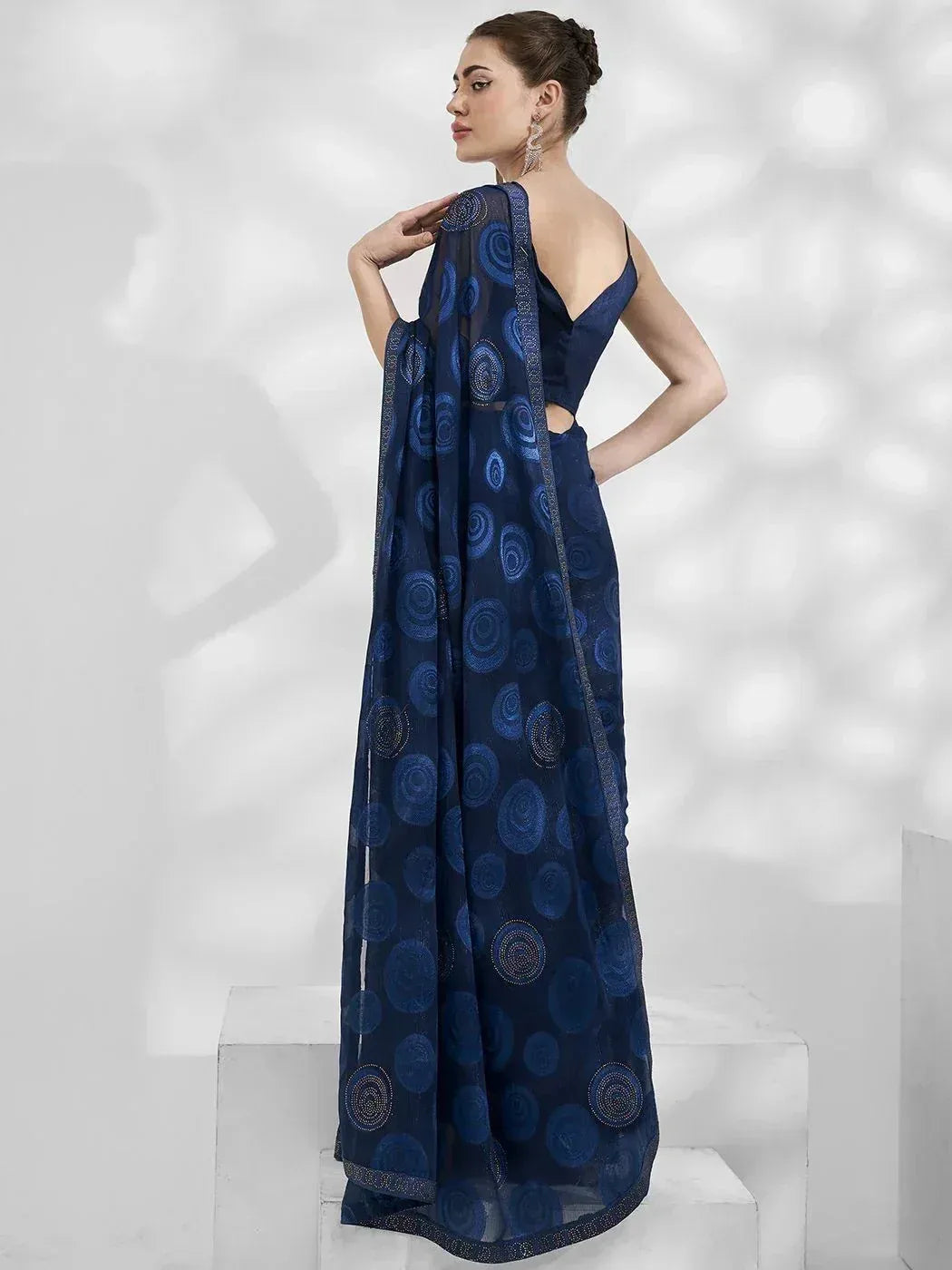 Navy blue designer saree with circular embroidery, perfect for Indian ethnic wear occasions