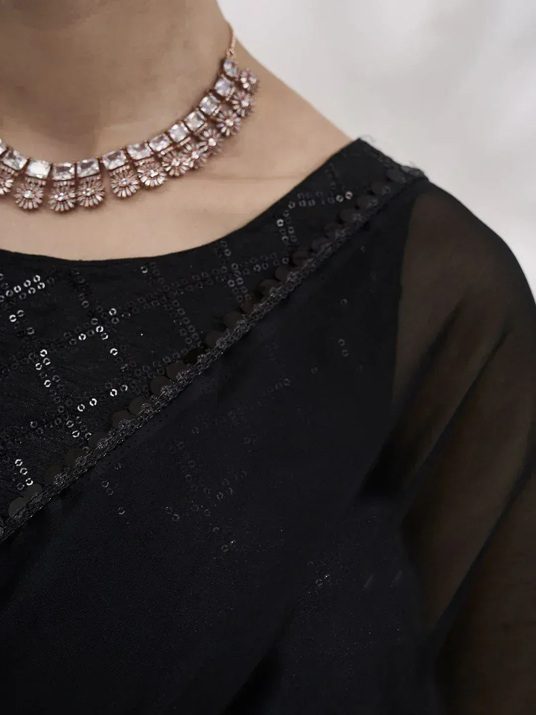 Black sequin ethnic blouse with sheer sleeves and statement necklace