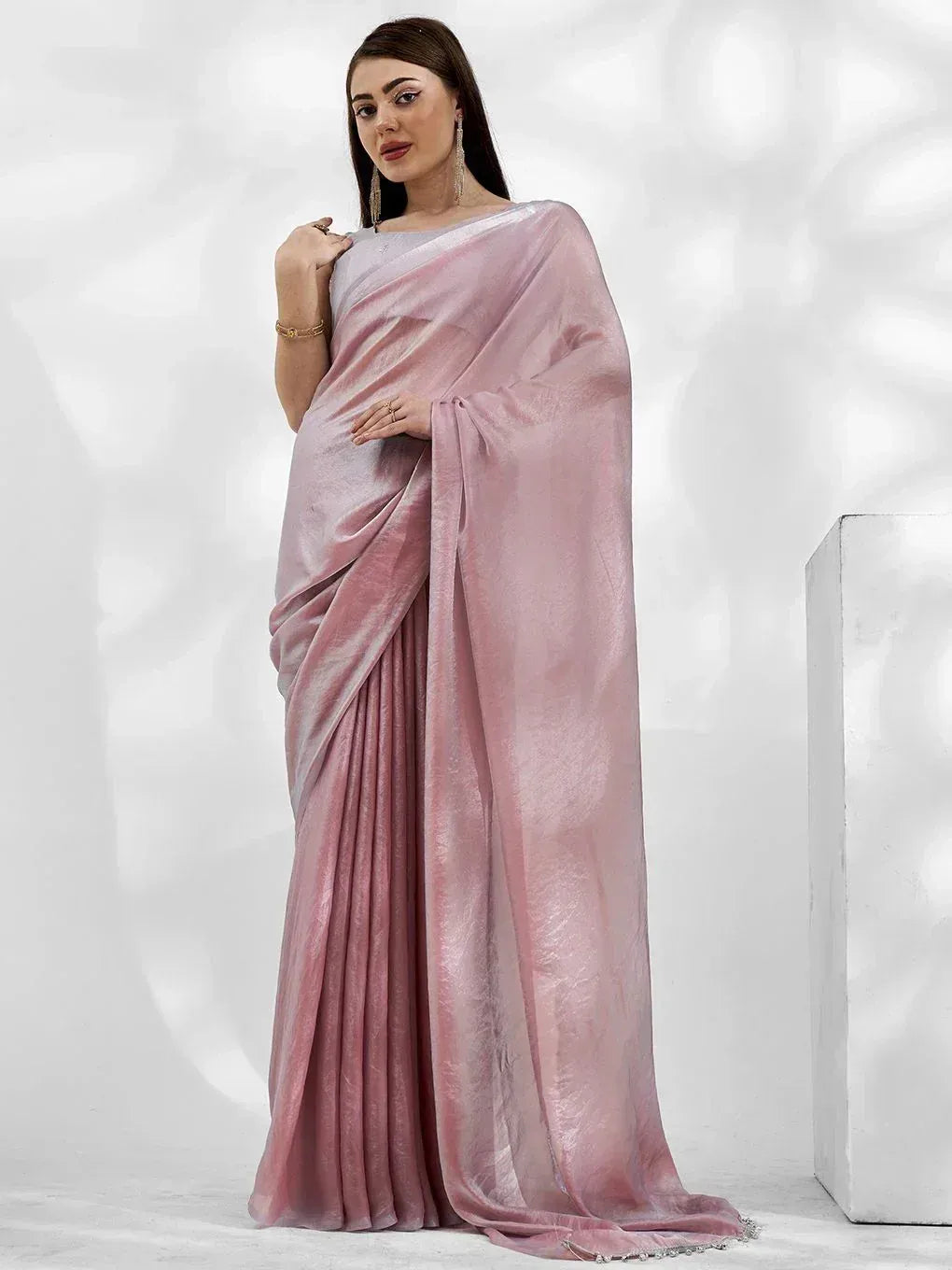 Elegant pink velvet saree with shimmering finish, perfect for ethnic occasions
