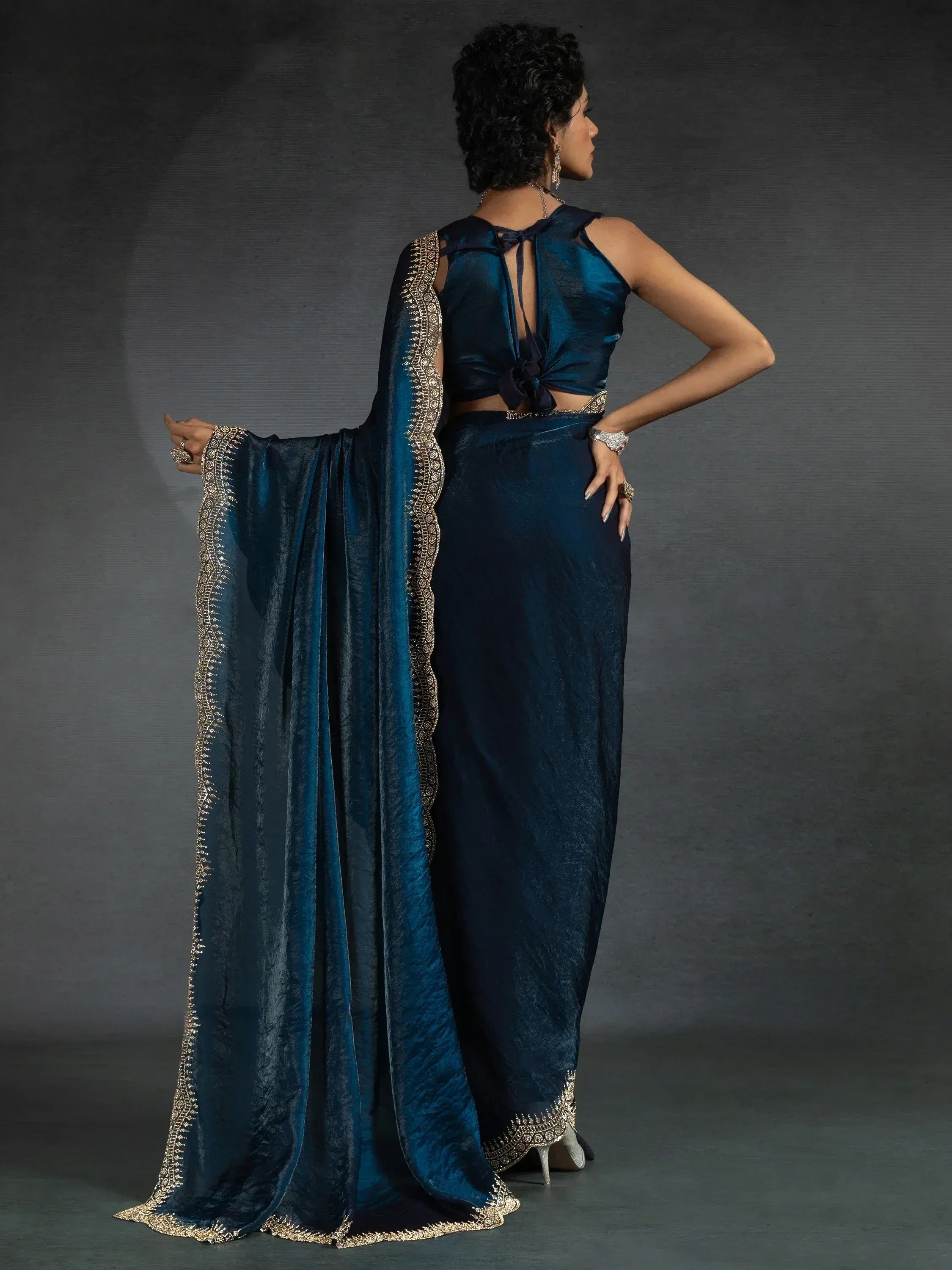 Elegant blue ethnic saree with gold embroidery and halter neck blouse