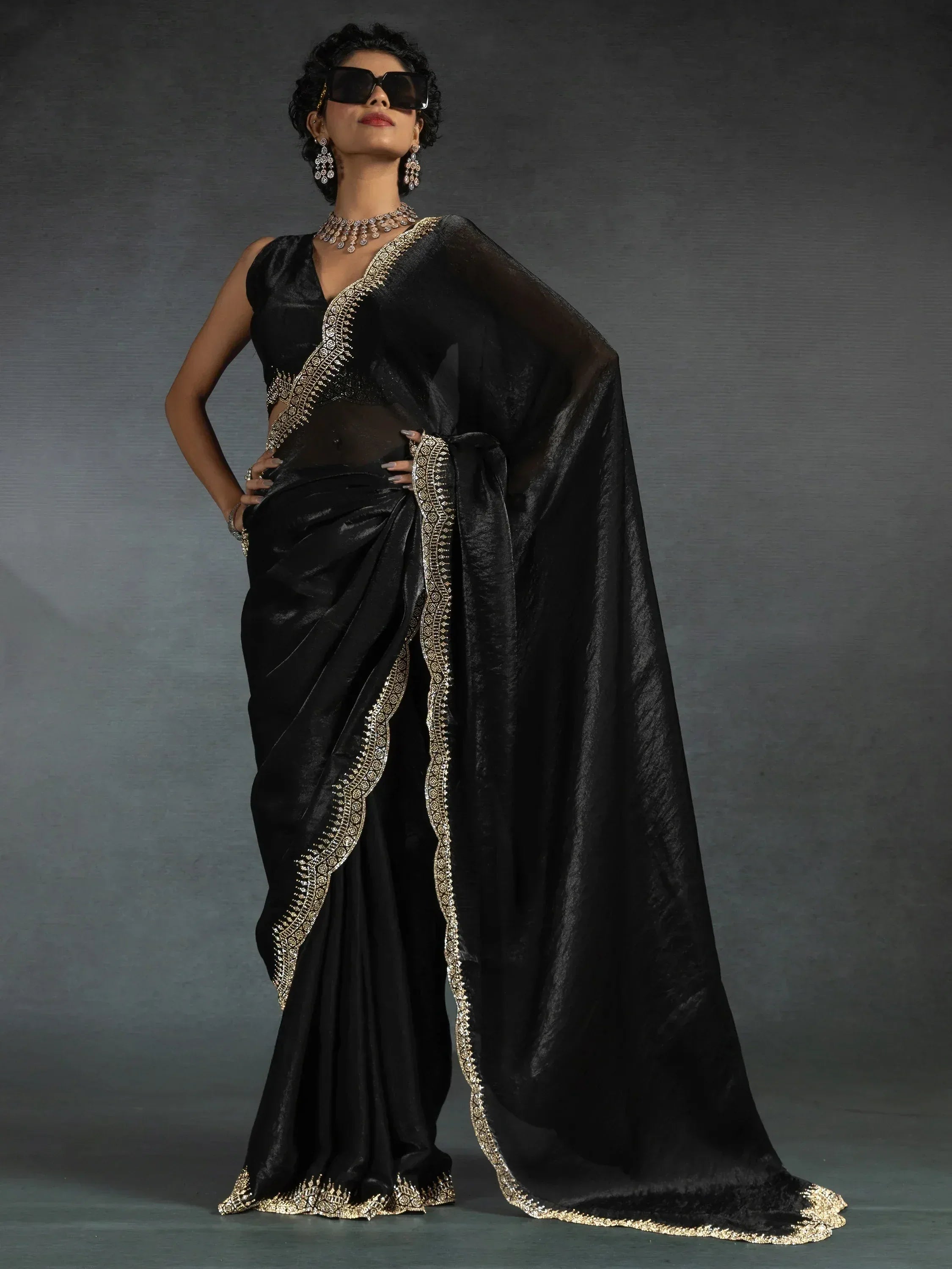 Black saree with gold embroidery, elegant Indian ethnic wear for women