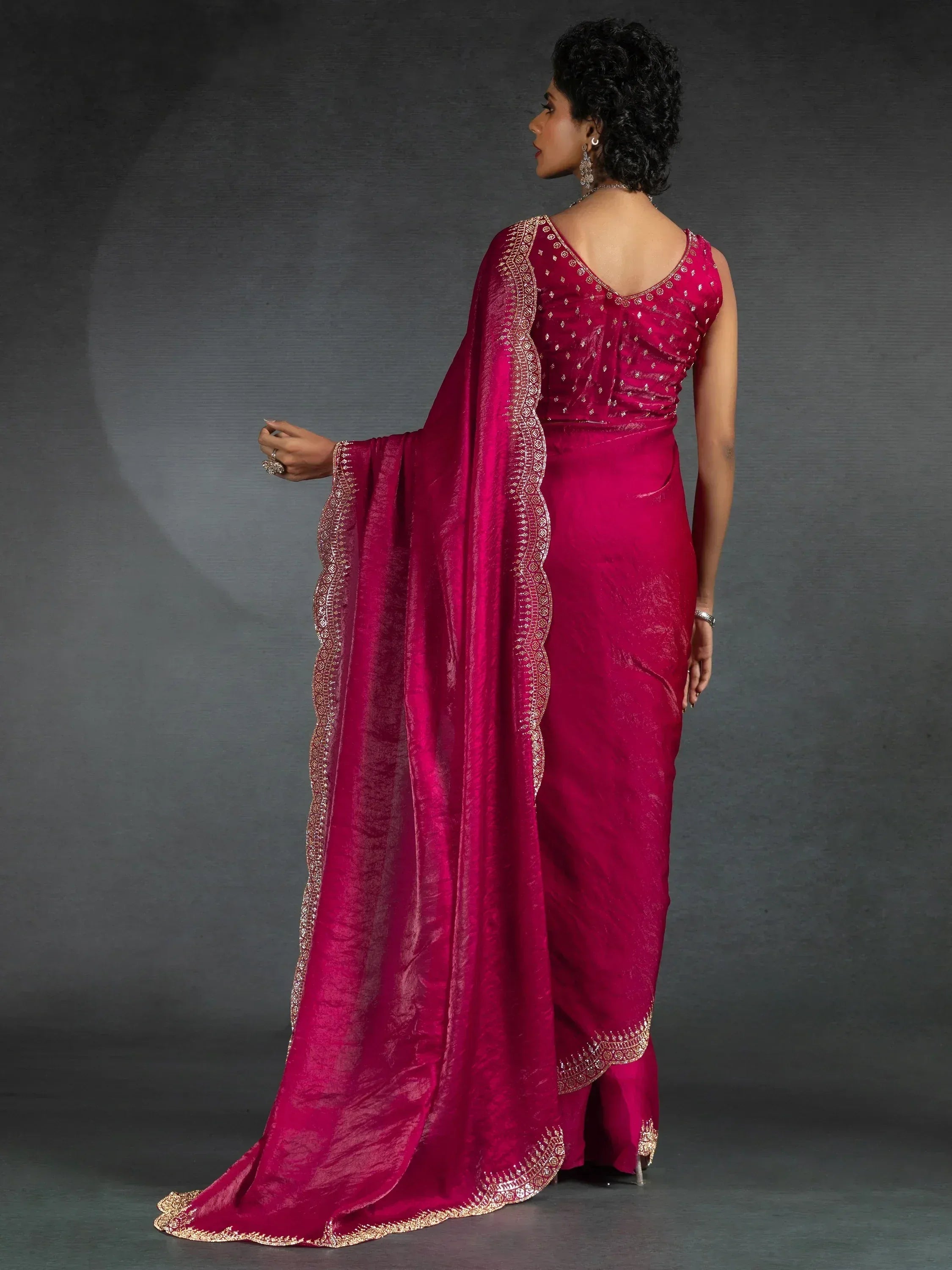 Elegant magenta saree with gold embroidery, perfect for Indian ethnic wear occasions.