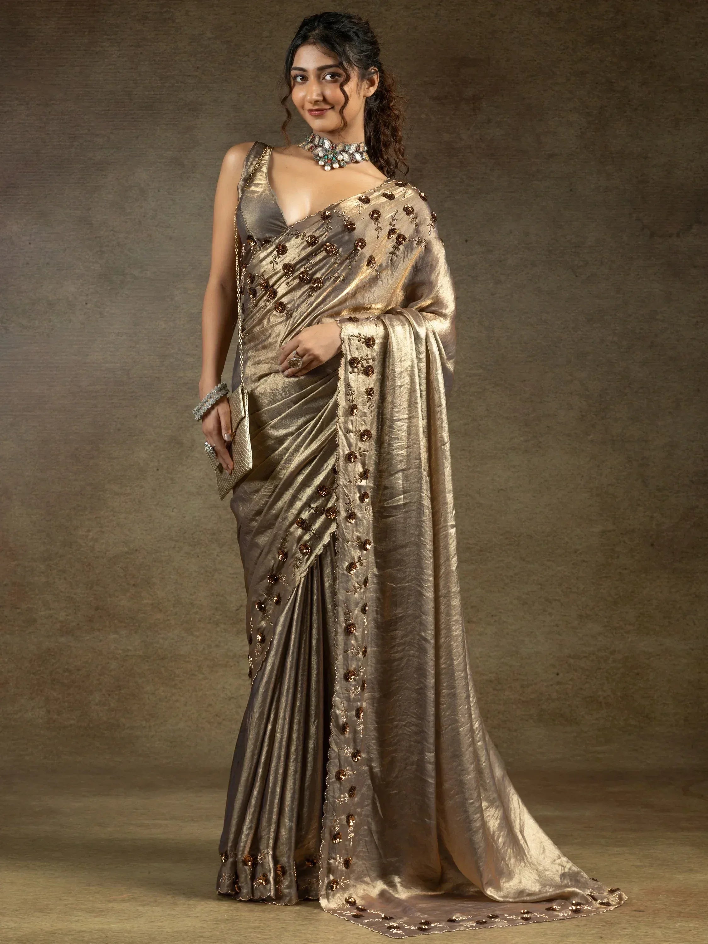 Elegant gold saree with floral embroidery, perfect for Indian ethnic wear occasions