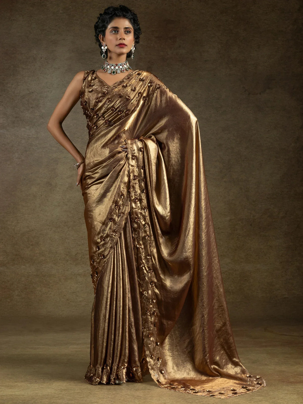 Elegant gold saree with intricate beadwork, perfect for Indian ethnic wear occasions