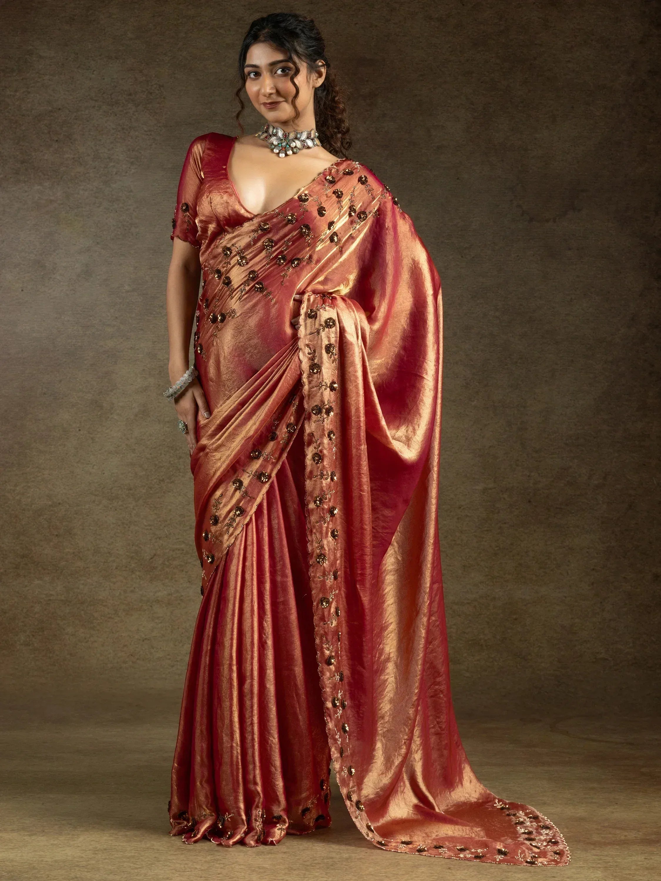 Elegant maroon saree with gold embroidery, perfect for Indian ethnic wear occasions.