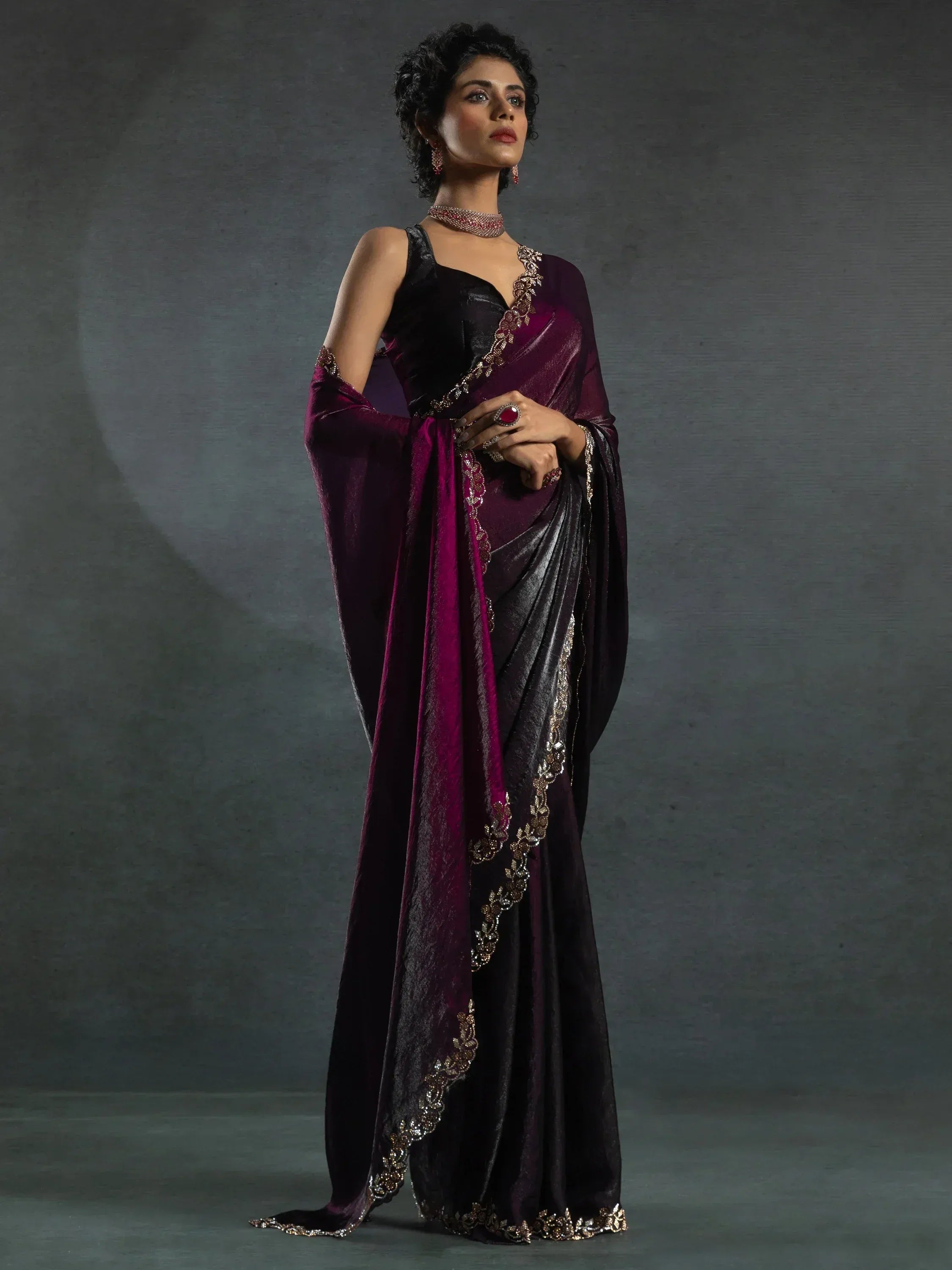 Elegant purple and black saree with gold embroidery, perfect for Indian ethnic wear occasions.