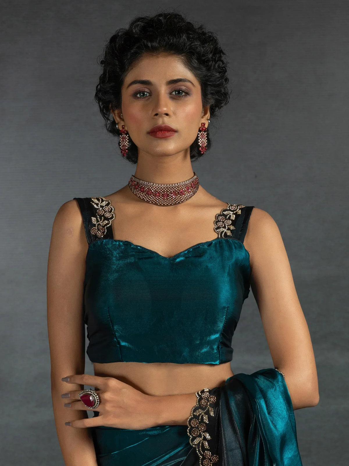 Teal velvet saree with embroidered blouse and statement jewelry