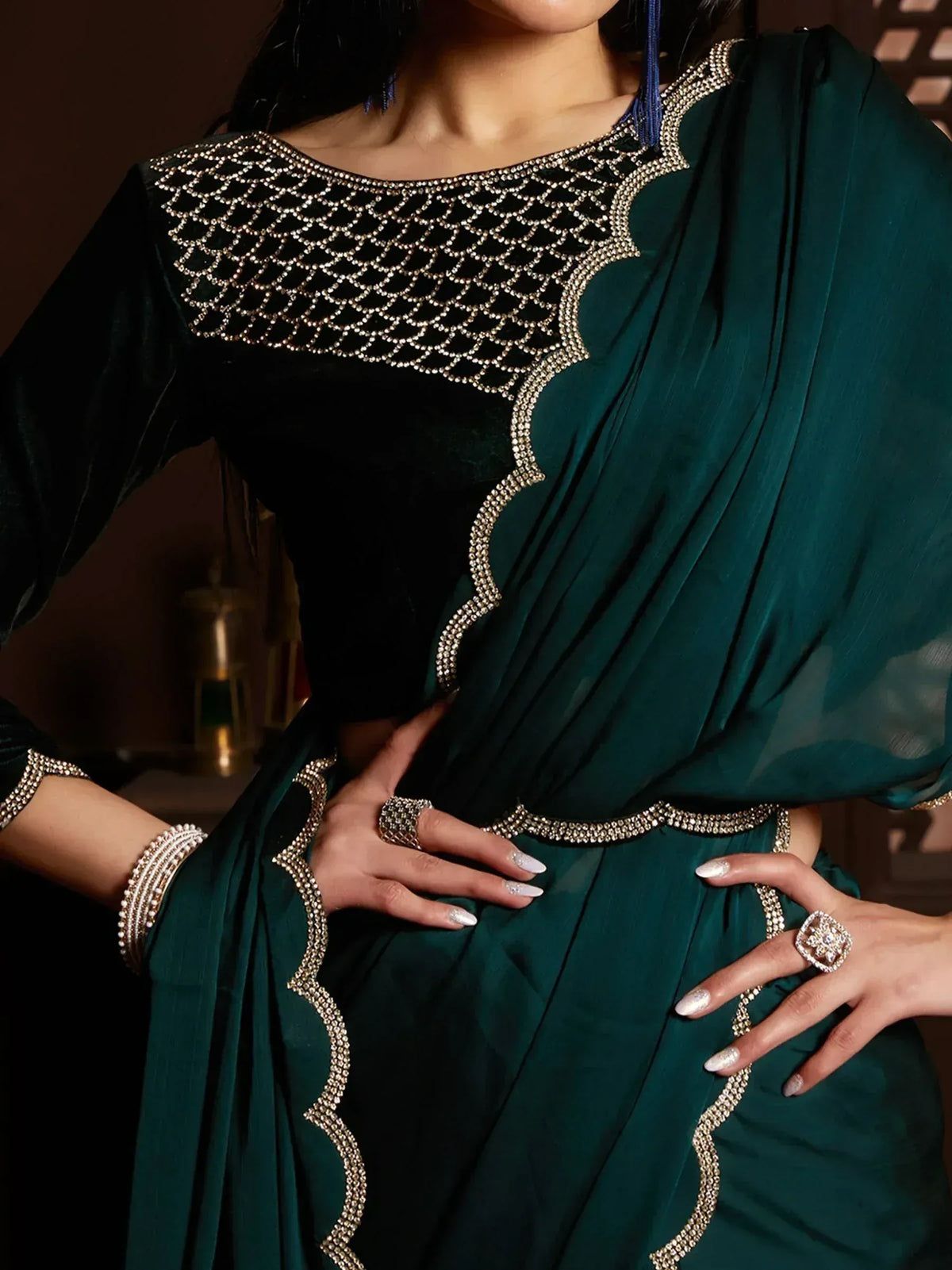 Emerald green ethnic gown with intricate gold beadwork and velvet bodice, perfect for Indian celebrations.