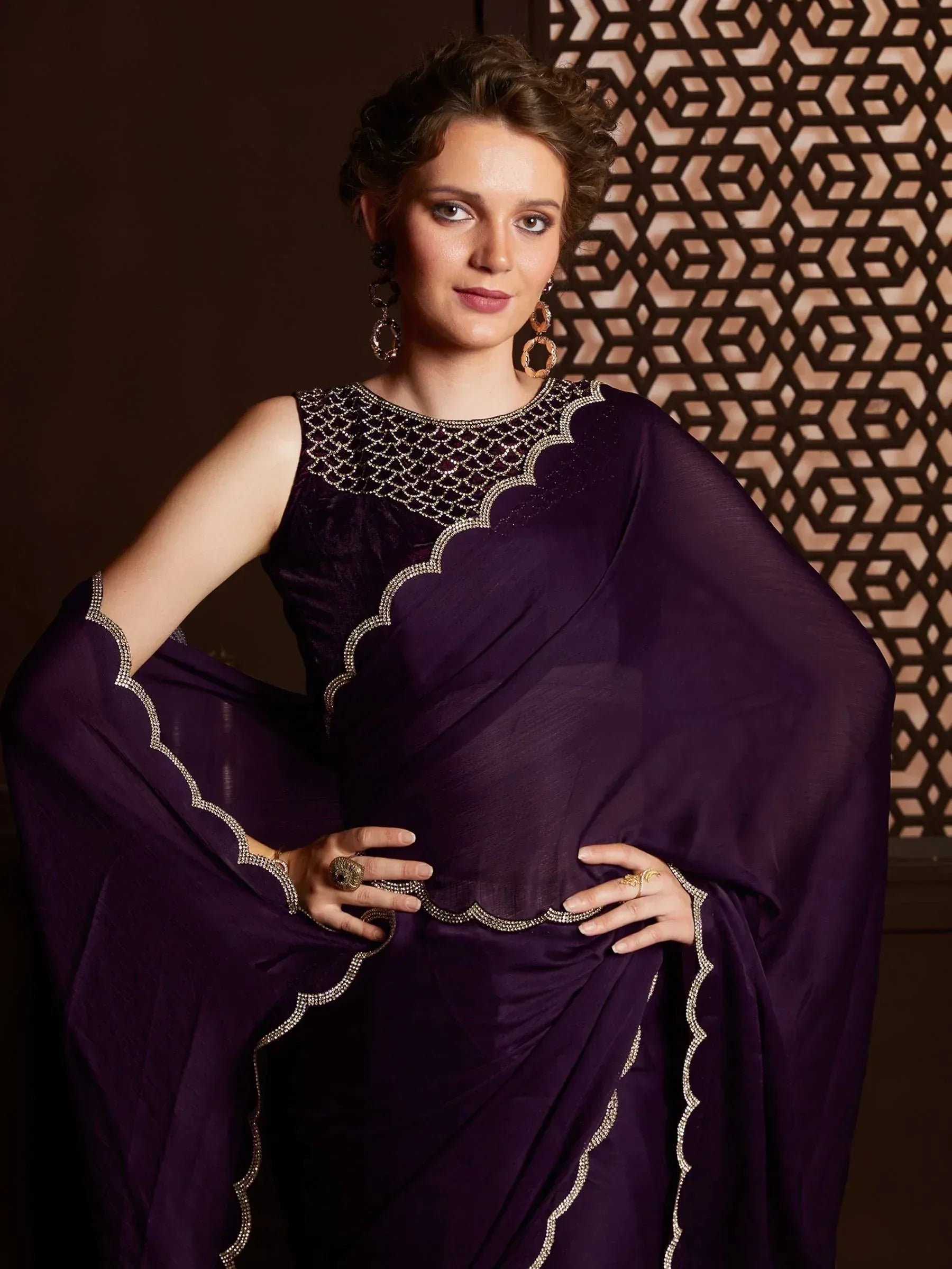 Elegant purple saree with intricate gold embroidery, perfect for Indian ethnic wear occasions.
