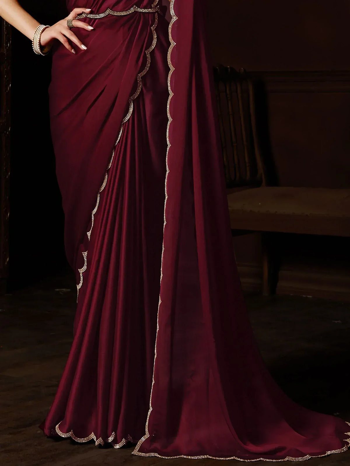 Elegant maroon saree with scalloped crystal border, perfect for Indian ethnic wear occasions