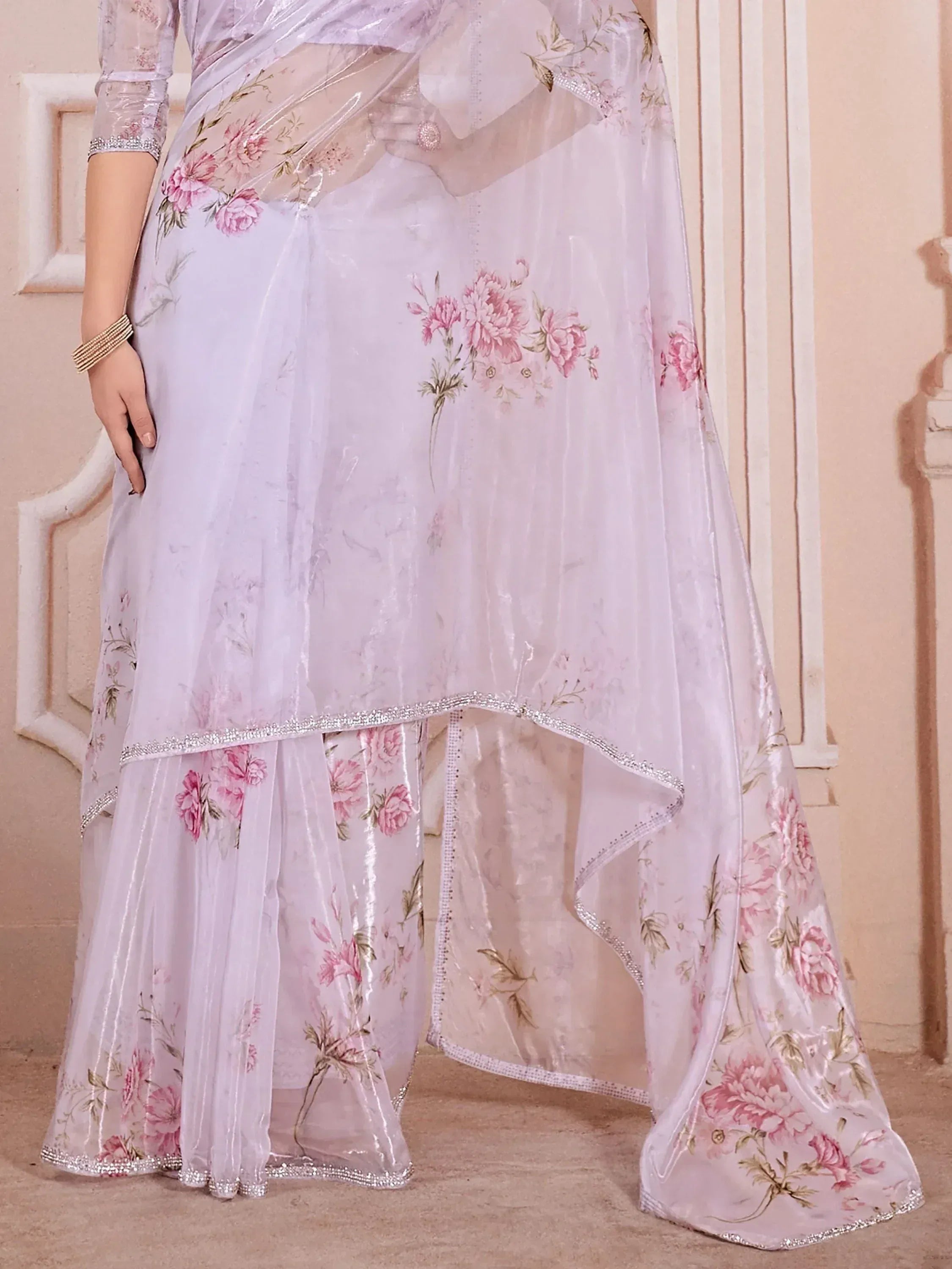 Light purple floral printed ethnic gown with sheer overlay and embellished hem, perfect for Indian occasions
