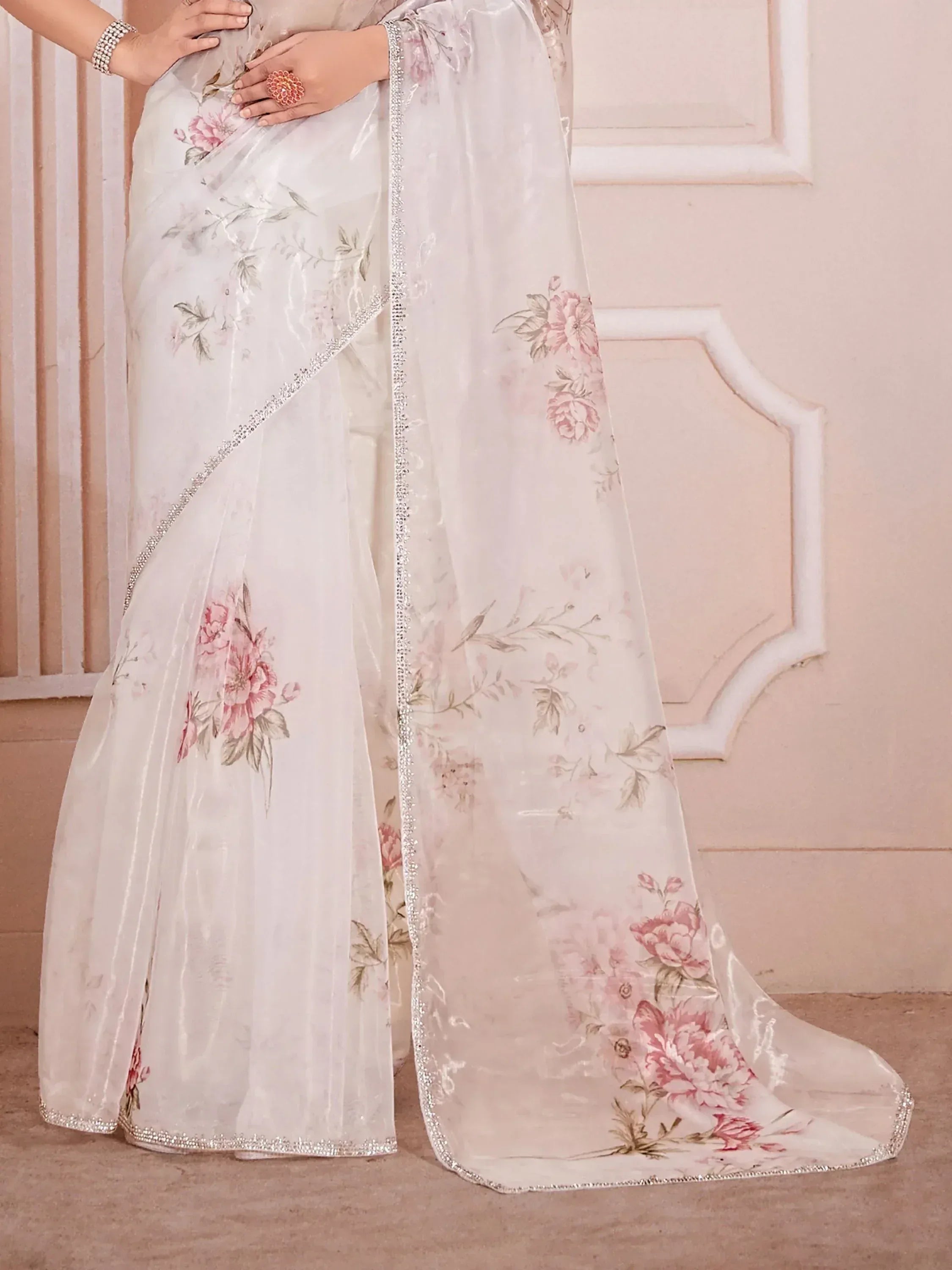 White floral saree with pink rose print and silver beaded border, elegant Indian ethnic wear