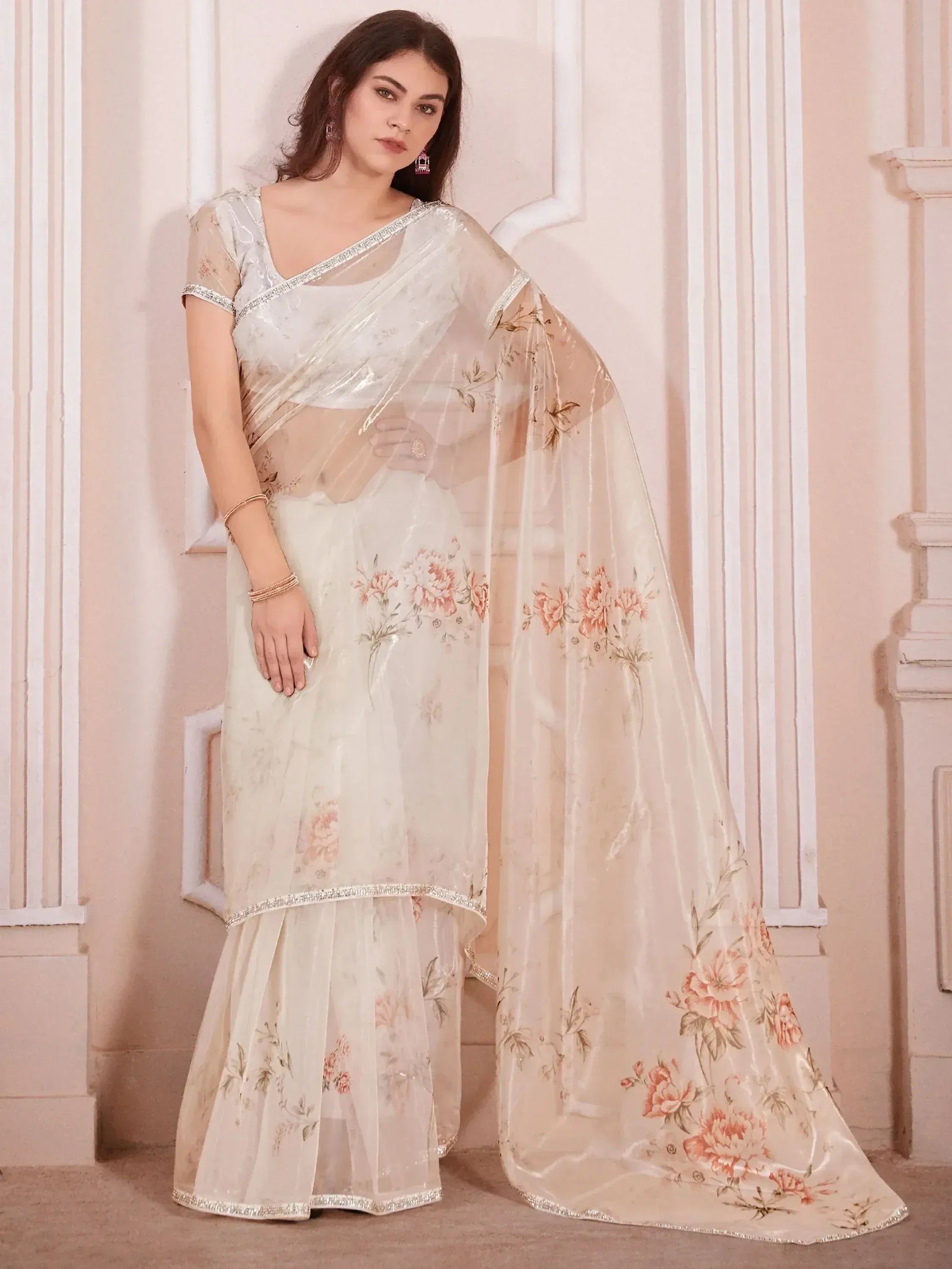 Elegant white floral saree with silver border, perfect for Indian ethnic wear and festive occasions.
