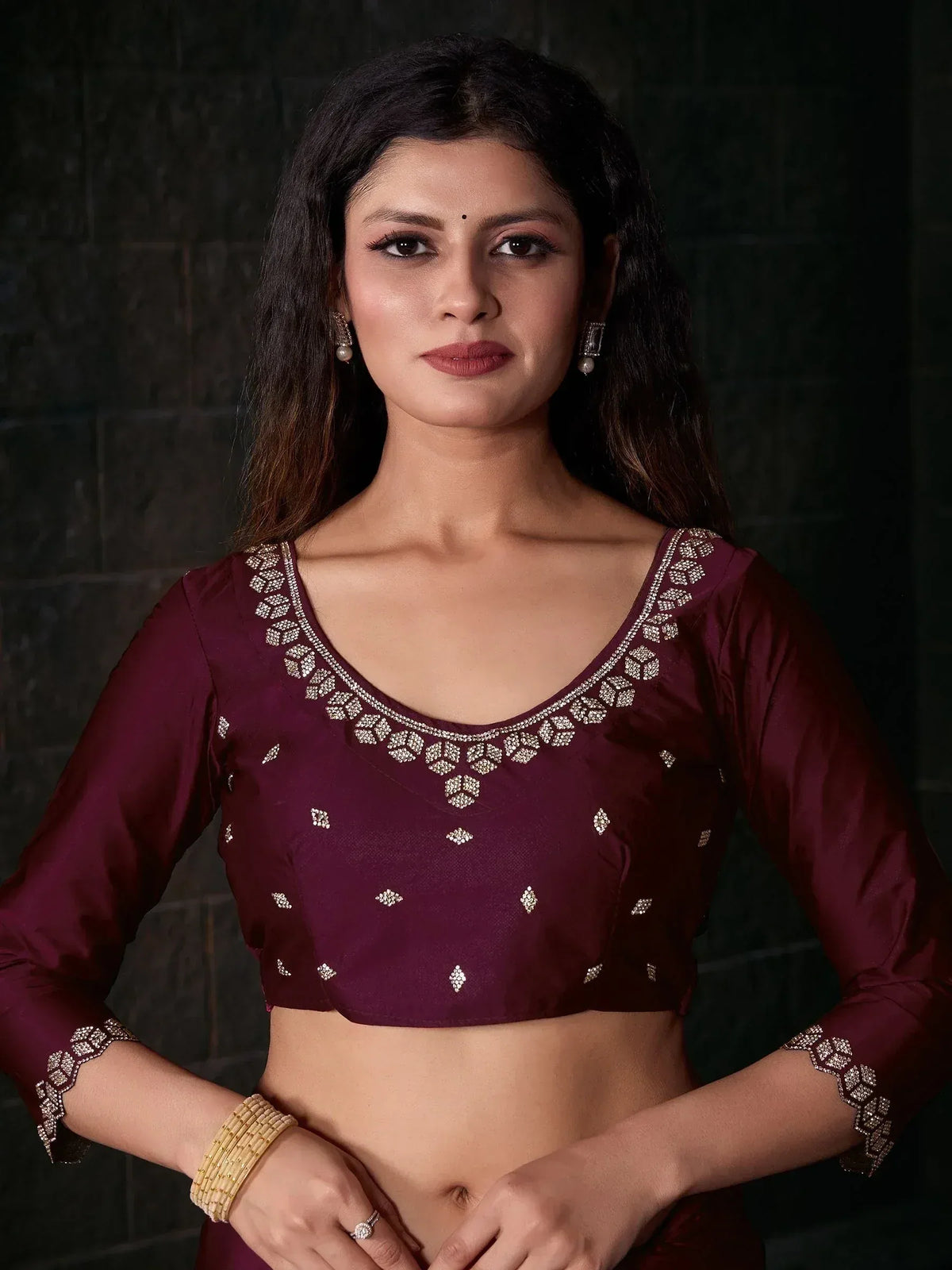 Maroon designer blouse with intricate silver embroidery, perfect for ethnic wear and festive occasions.