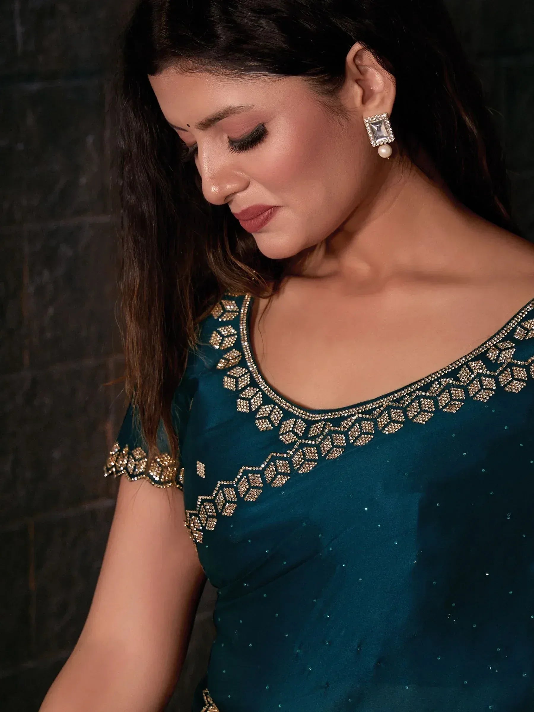 Teal ethnic gown with gold embroidery, perfect for Indian weddings or festive occasions.