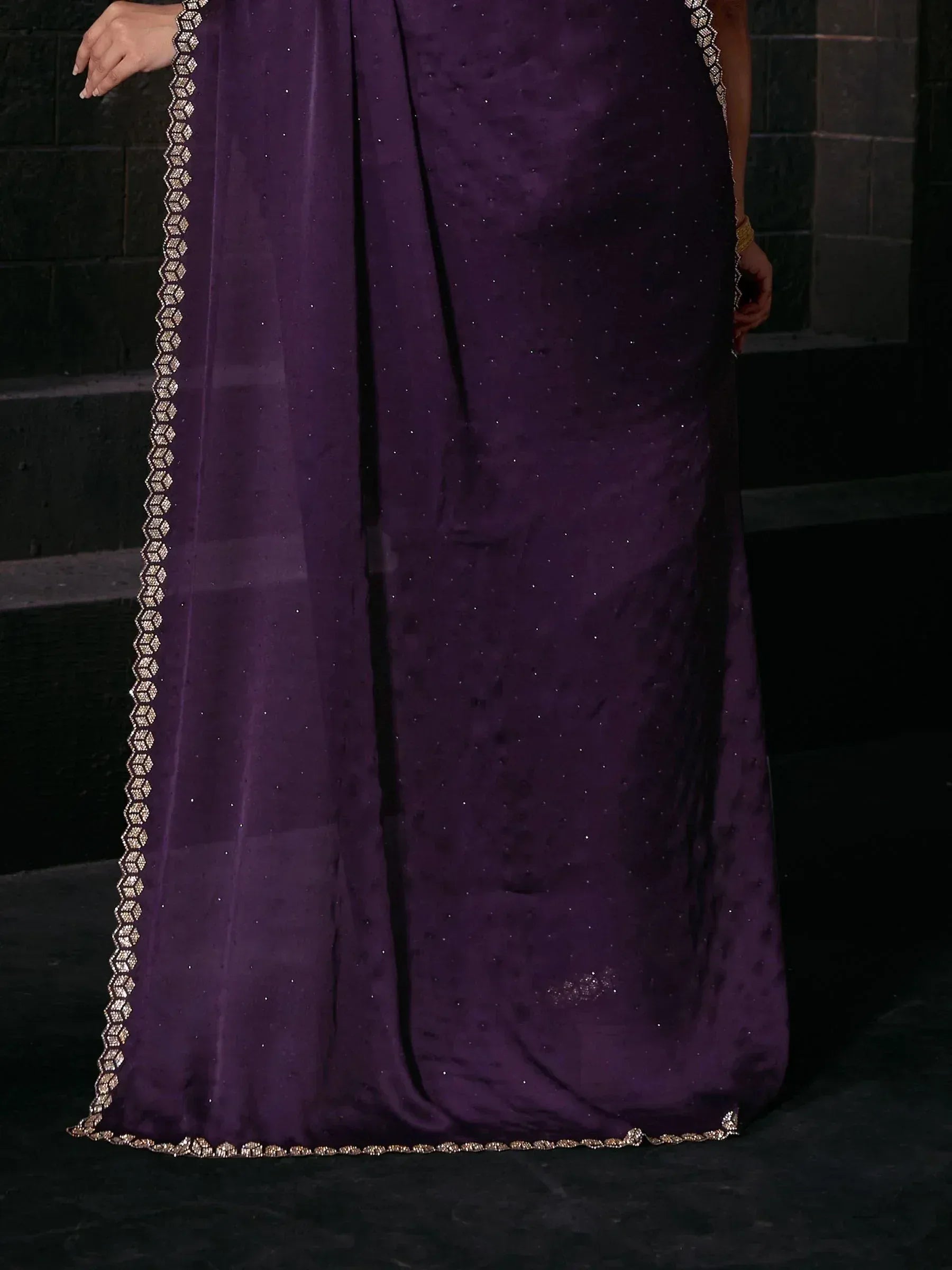 Purple ethnic gown with gold embroidery and sheer dupatta, perfect for Indian celebrations
