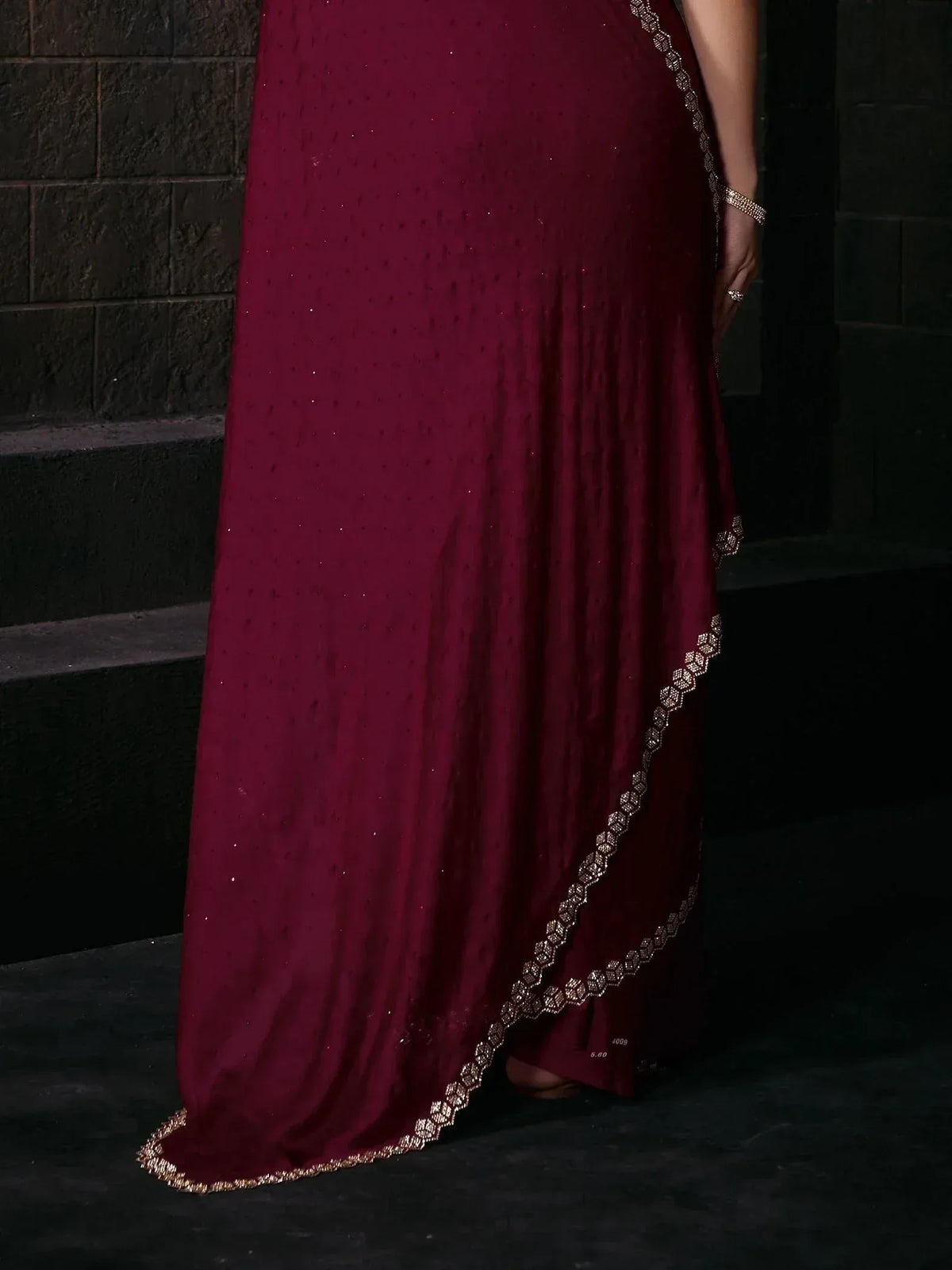 Maroon ethnic gown with gold embroidery, perfect for Indian weddings and festive occasions
