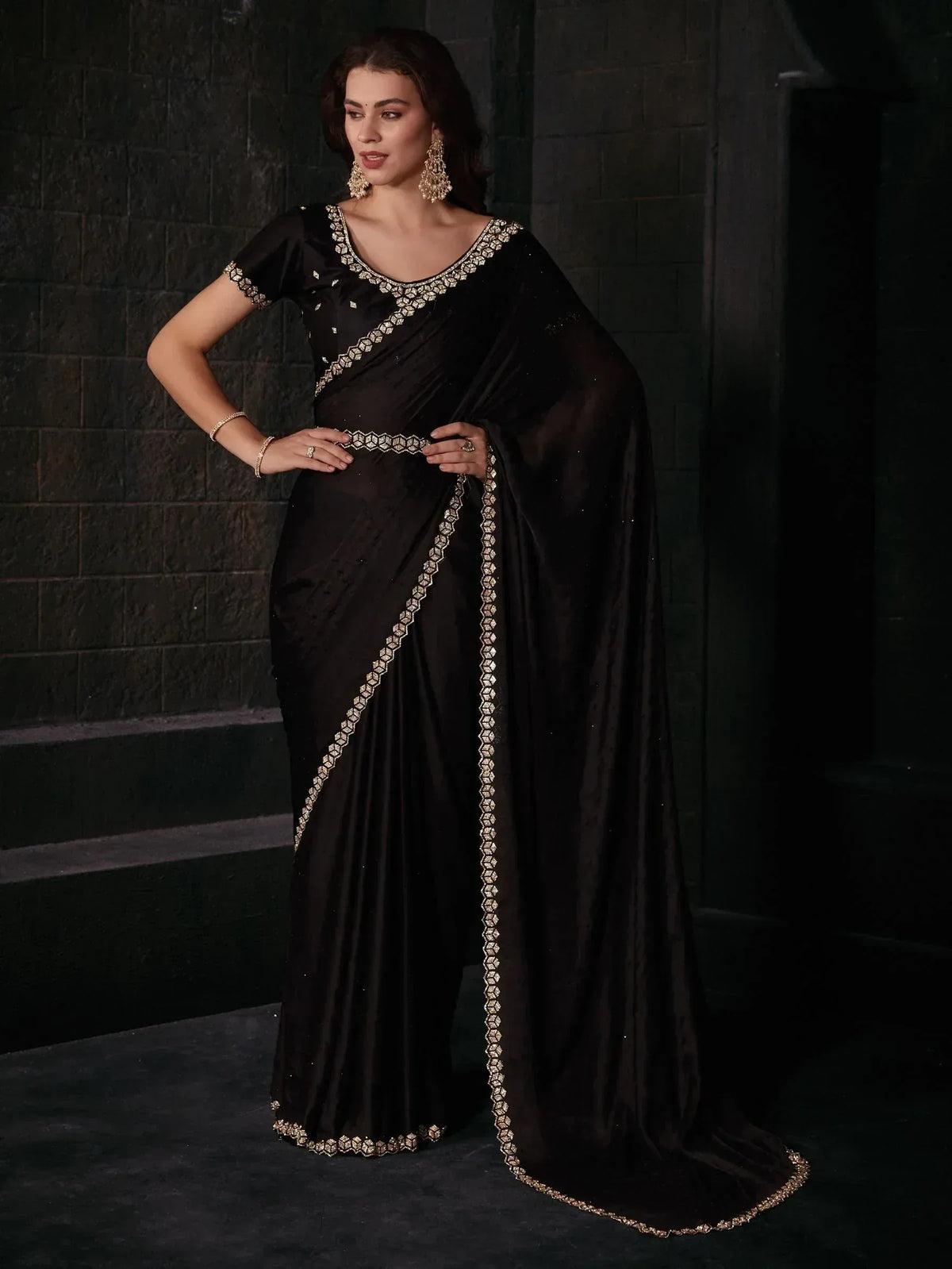 Elegant black saree with gold embroidery, perfect for Indian ethnic wear and festive occasions.