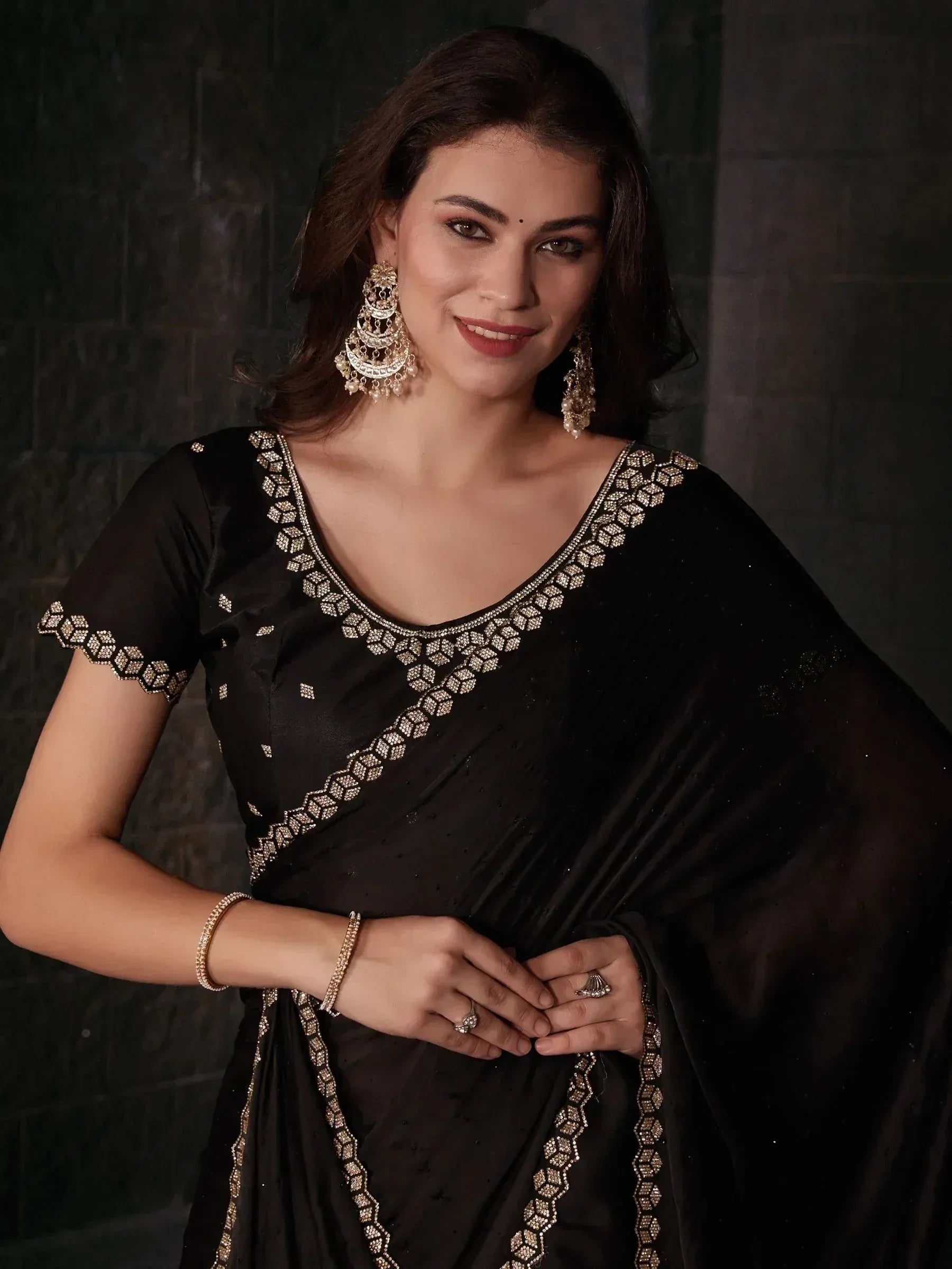Black embroidered saree with gold detailing, perfect for Indian ethnic wear and festive occasions.