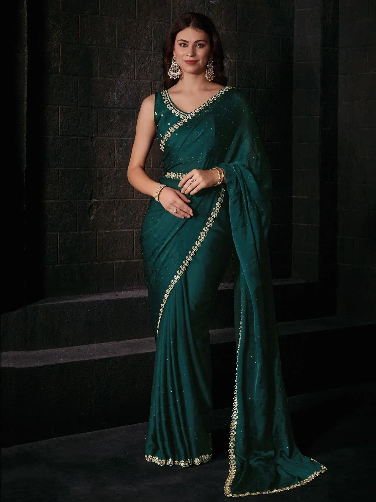 Emerald green saree with gold embroidery, perfect for Indian ethnic wear and festive occasions.