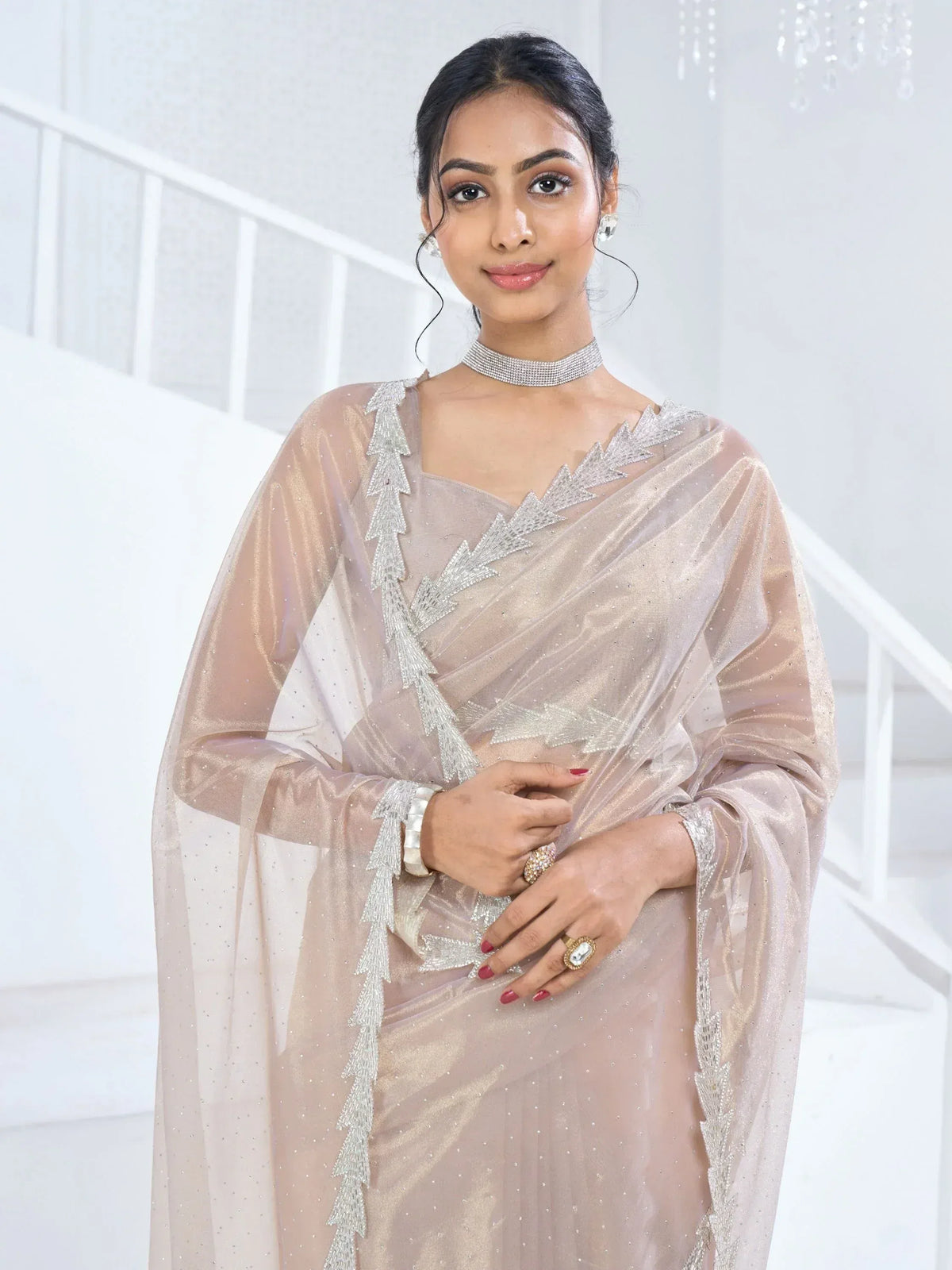 Elegant beige saree with silver embroidery, perfect for Indian ethnic wear and festive occasions.