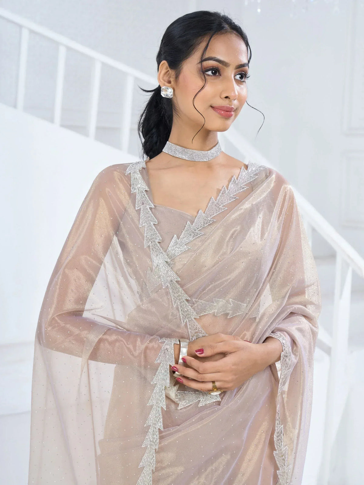 Elegant beige saree with silver embroidery, perfect for Indian ethnic wear events