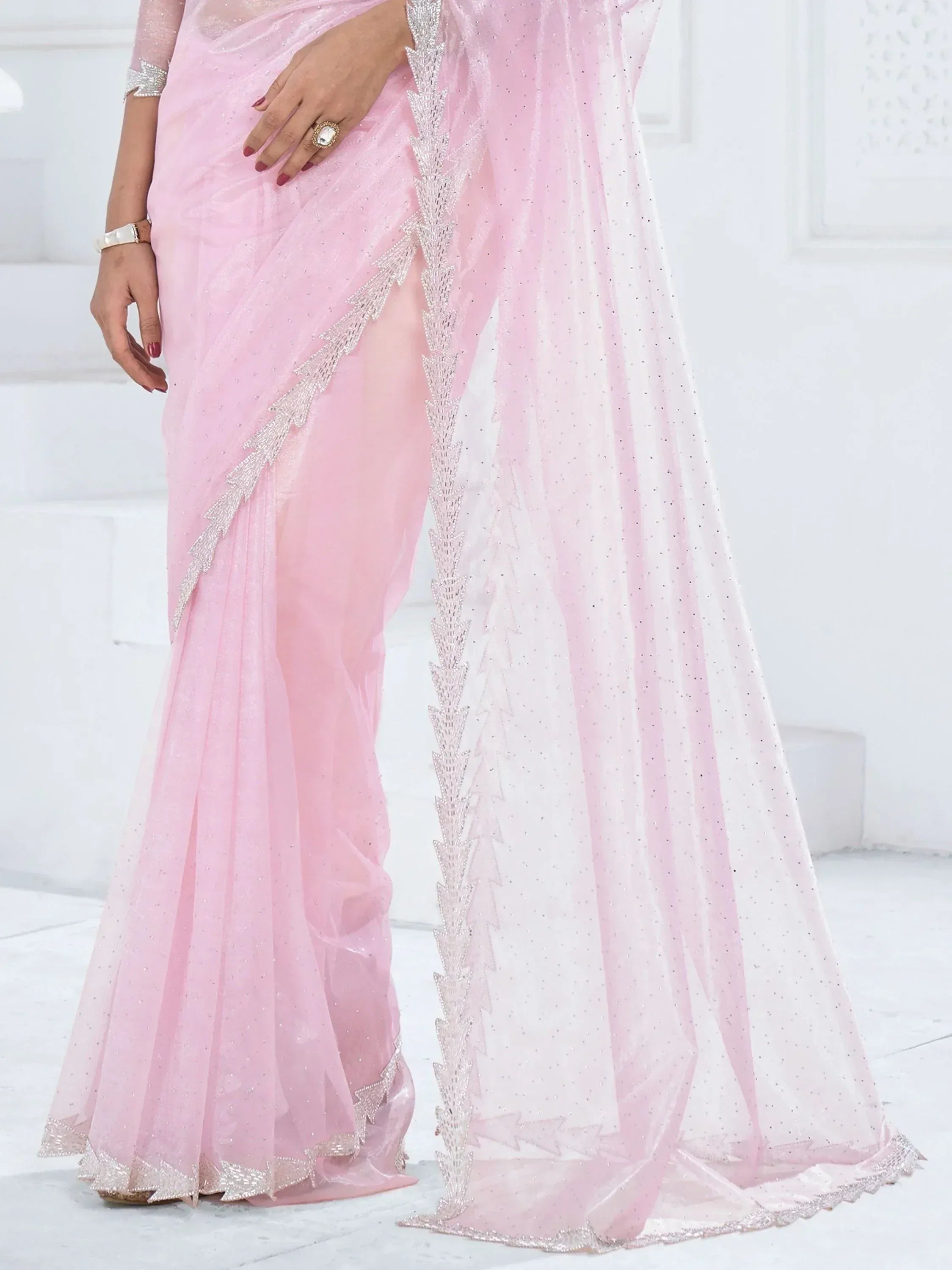 Pink sheer saree with silver embroidery, perfect for Indian ethnic wear and festive occasions.