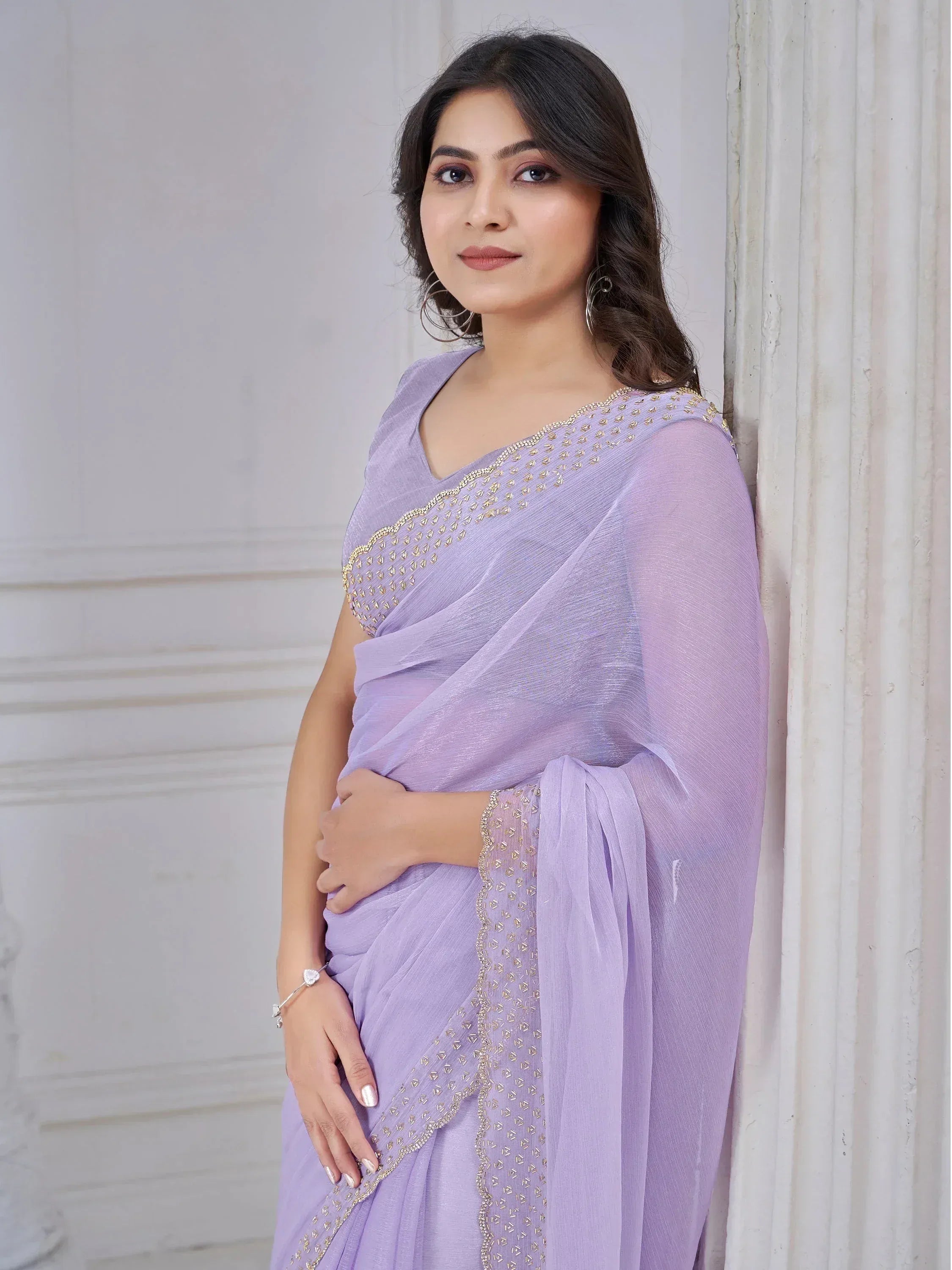 Lavender ethnic saree with gold embroidery, perfect for Indian occasions and festive wear.