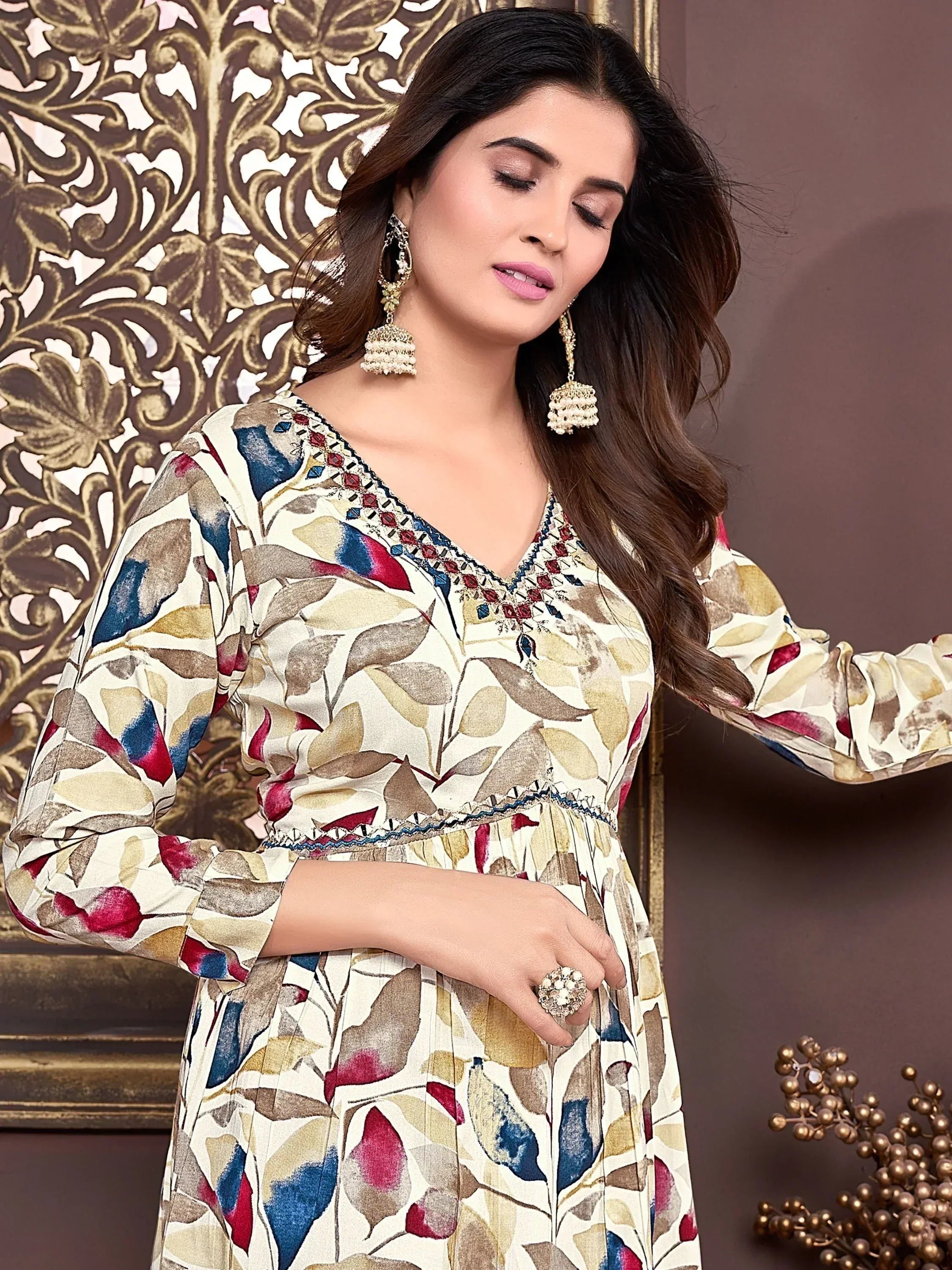 Floral print ethnic gown with embroidered neckline, perfect for Indian occasions and festive wear.