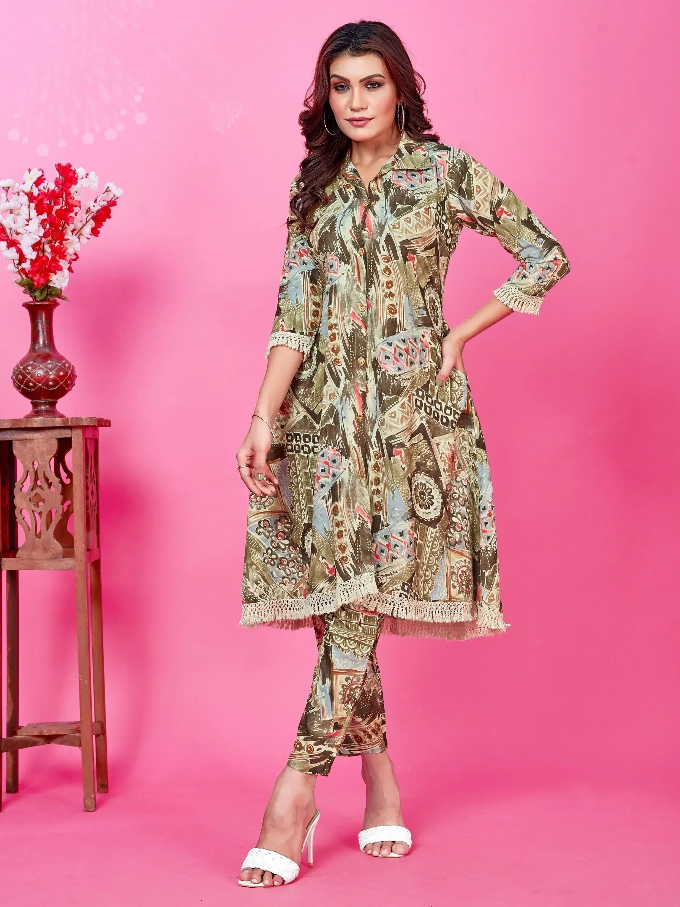 Ethnic printed kurta with matching pants and fringed hem, styled for modern Indian wear