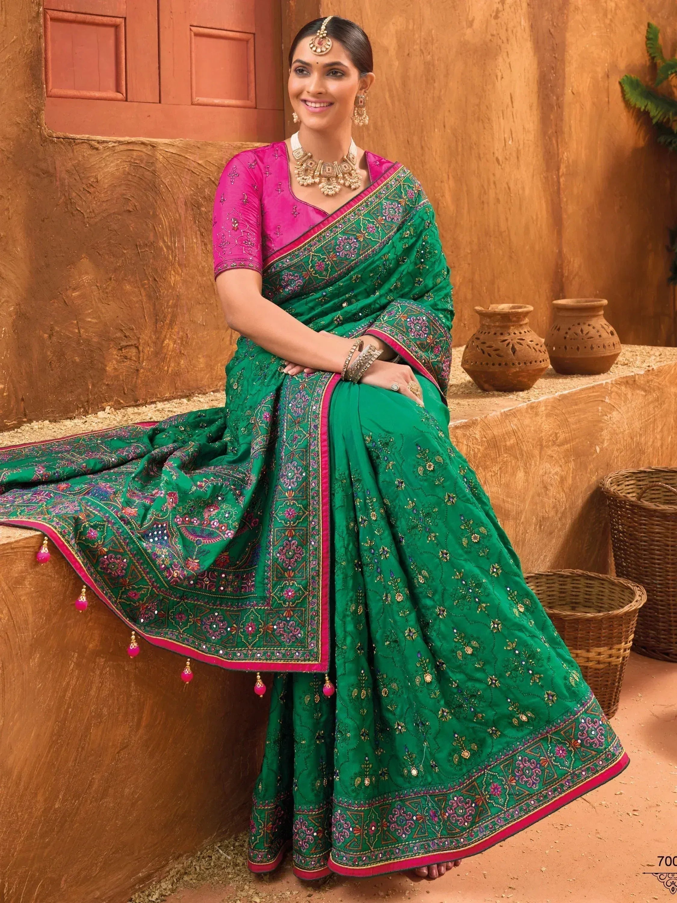 Emerald green embroidered saree with pink blouse, traditional Indian ethnic wear for women