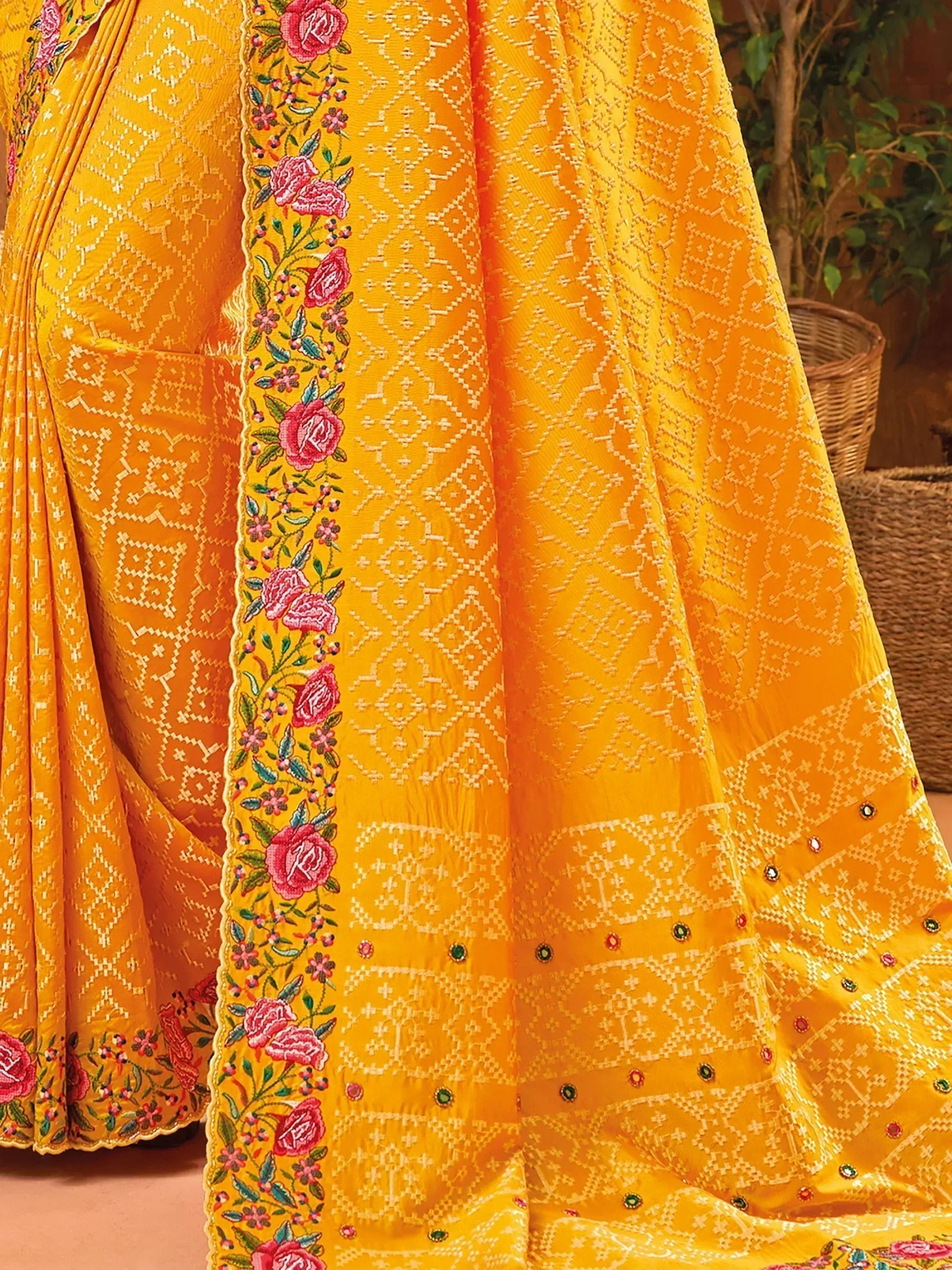 Yellow ethnic saree with floral embroidery and geometric patterns, perfect for Indian occasions