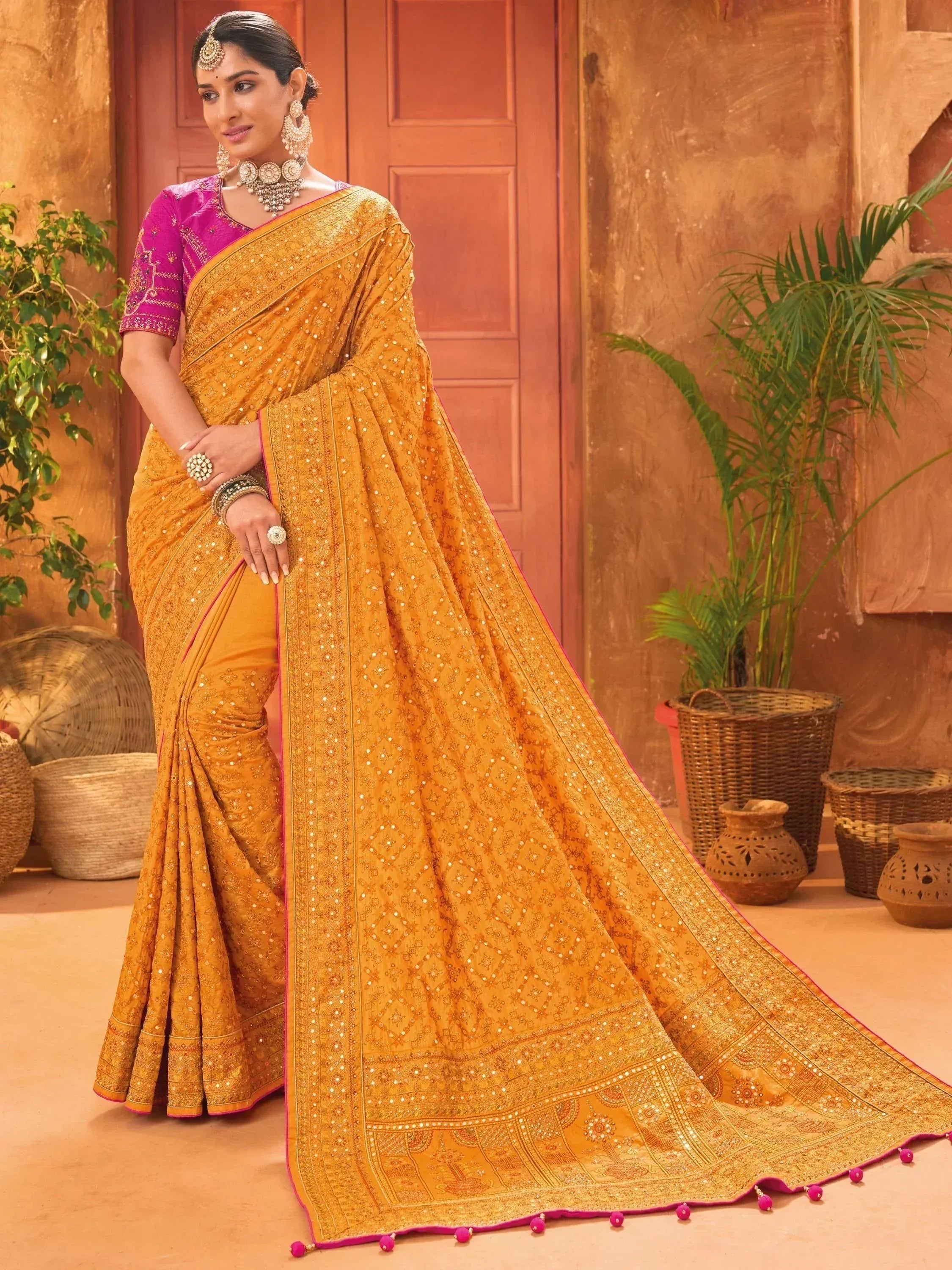Golden embroidered saree with pink blouse, traditional Indian ethnic wear for festive occasions