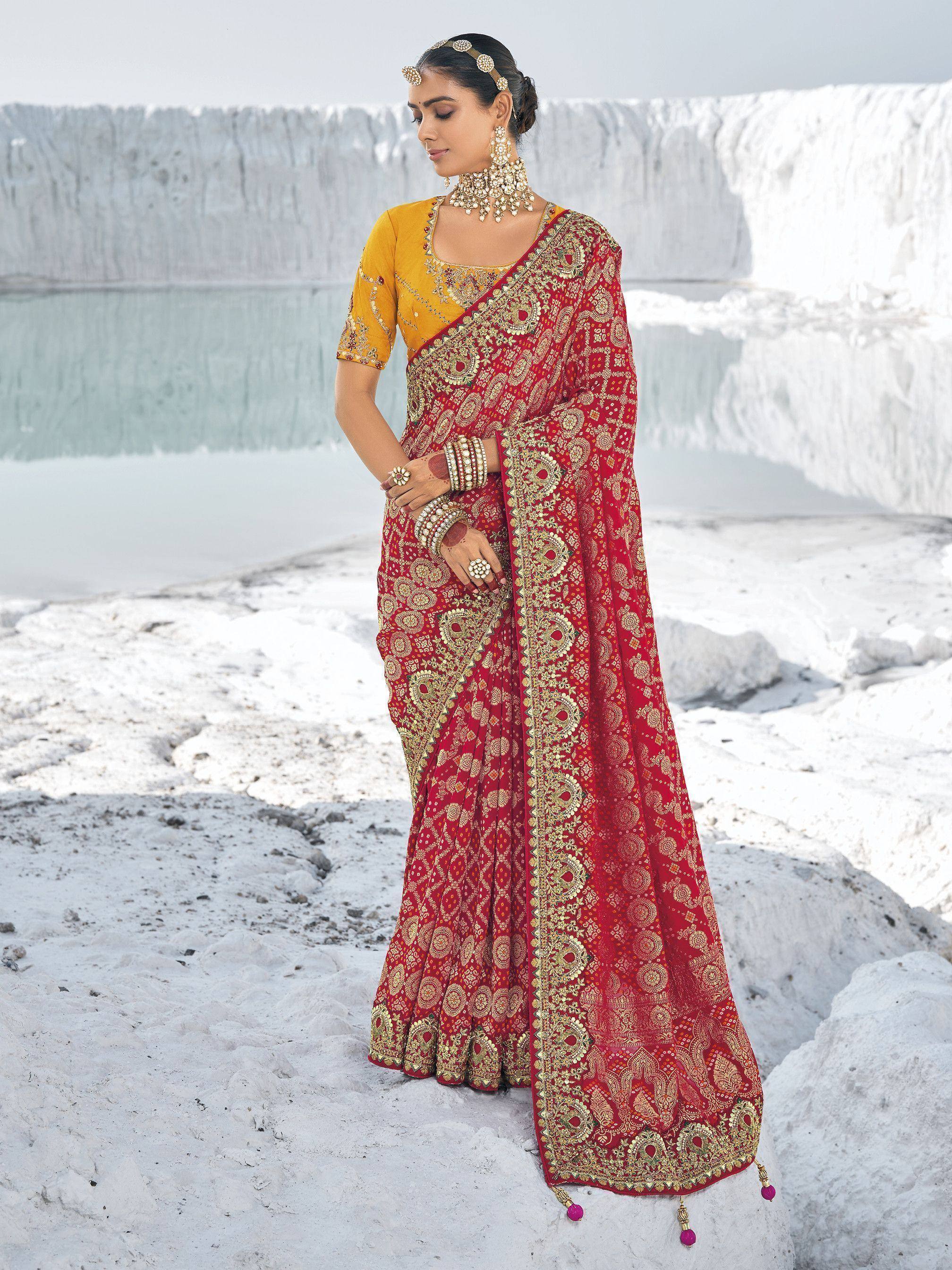 Red and gold embroidered saree with yellow blouse, traditional Indian ethnic wear for weddings and festivals