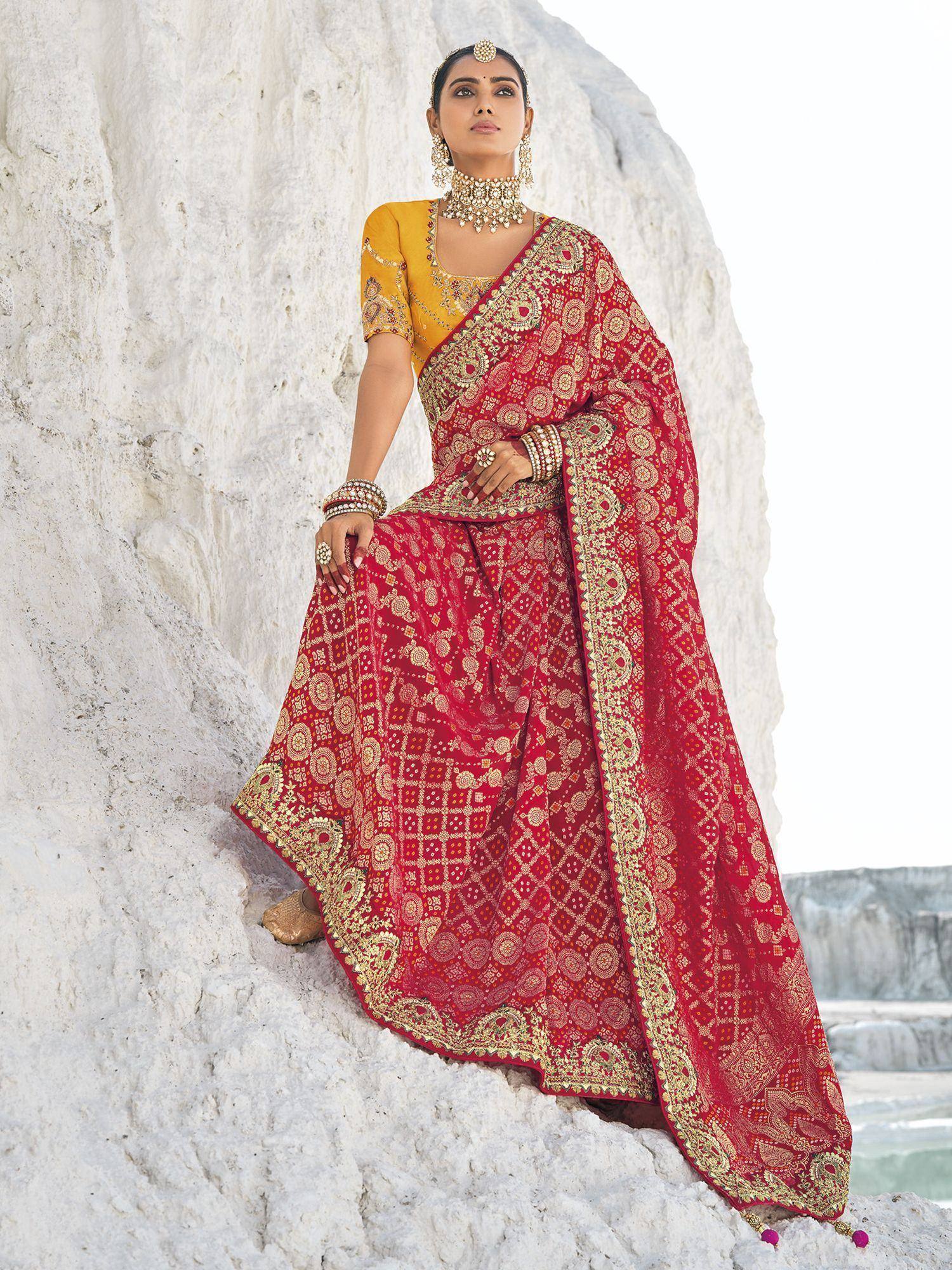 Red and gold embroidered lehenga choli with yellow blouse, styled for Indian ethnic wear